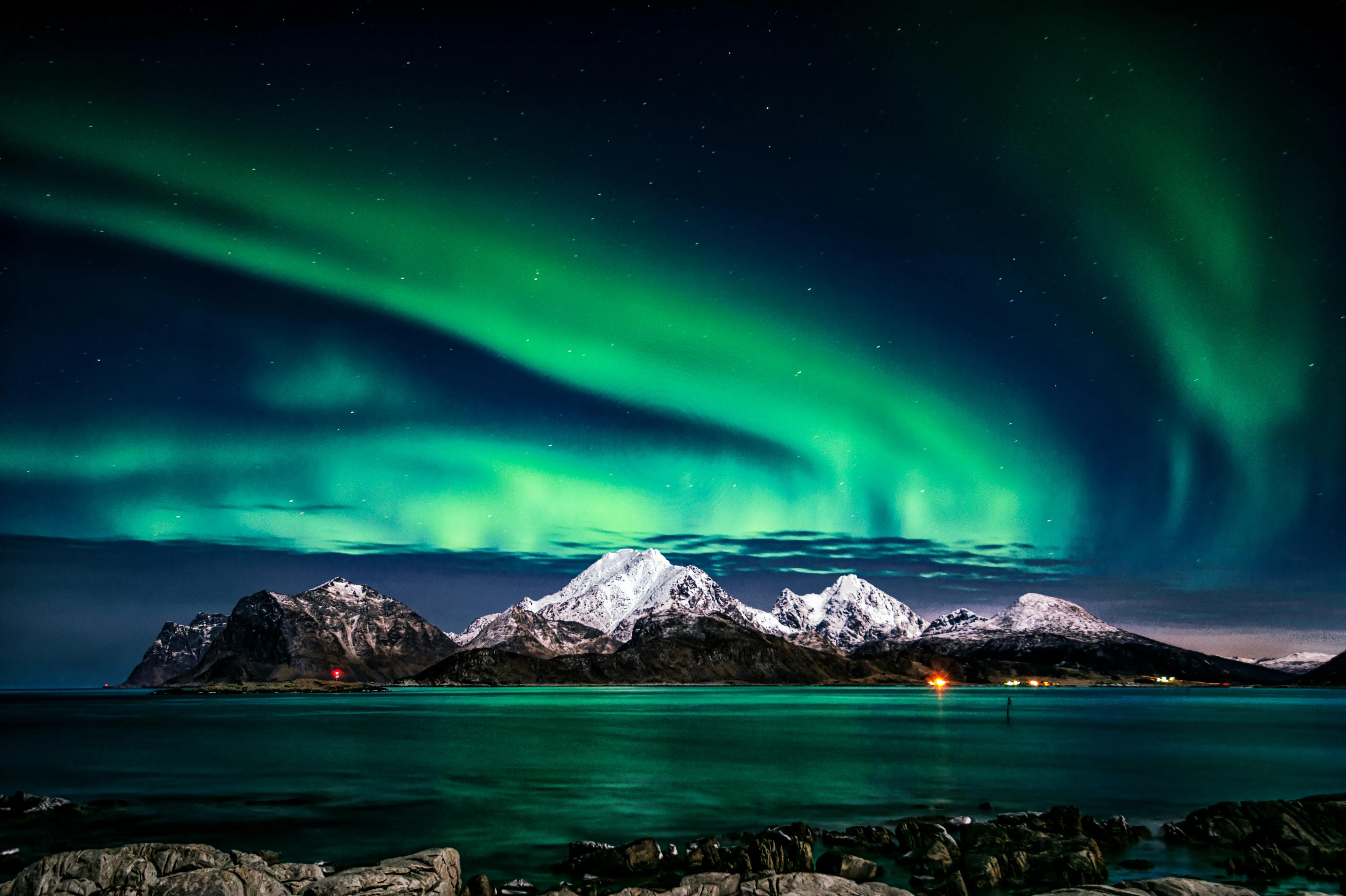 Beautiful Aurora Borealis Over Snow Covered Mountains