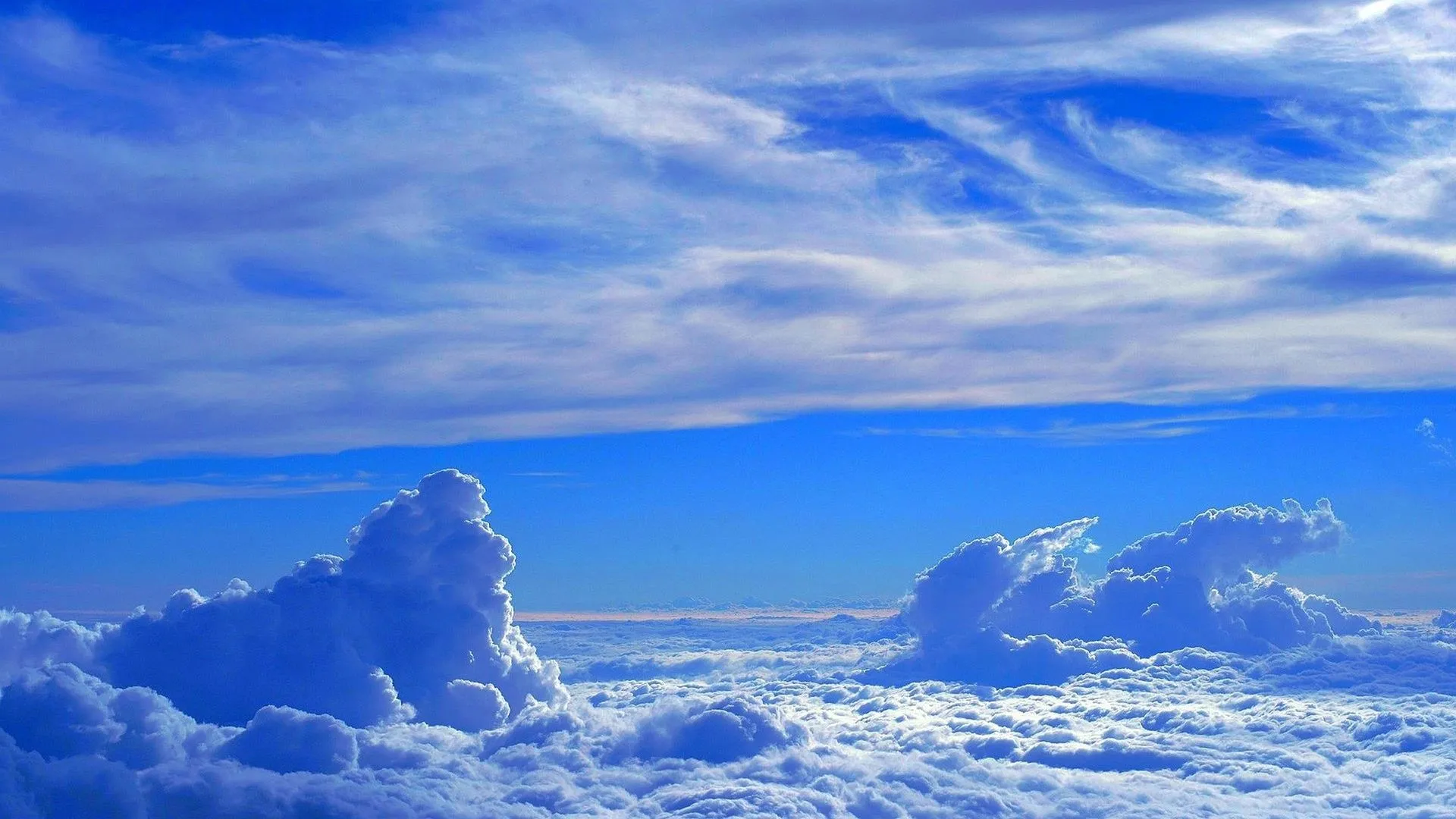 Beautiful Blue Sky with Large White Clouds Over Green Fields