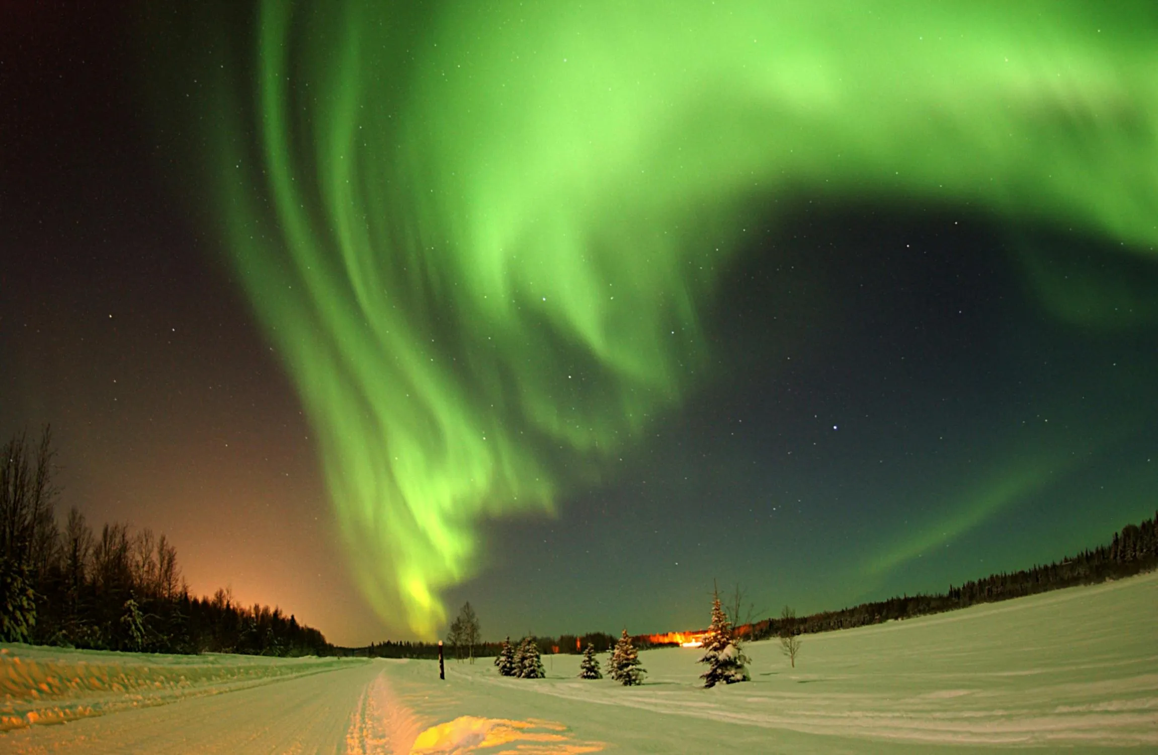 Beautiful Green Northern Lights Dancing Above Dark Night Sky
