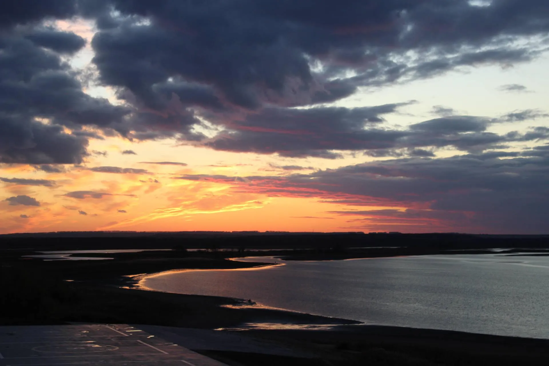 Beautiful Sunset Over the Ocean with Dark Clouds Image