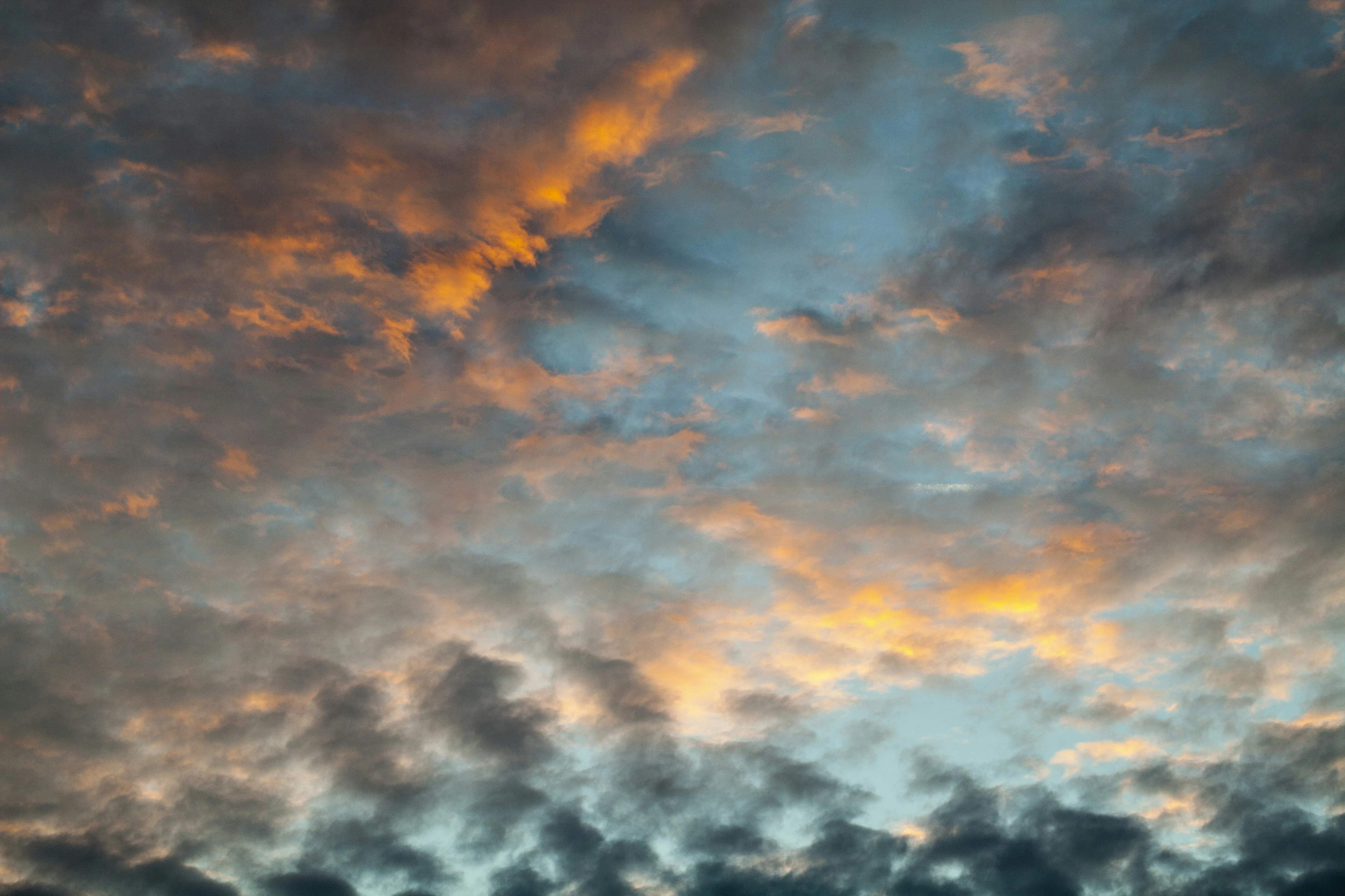 Beautiful Sunset Sky with Orange and Blue Colored Clouds
