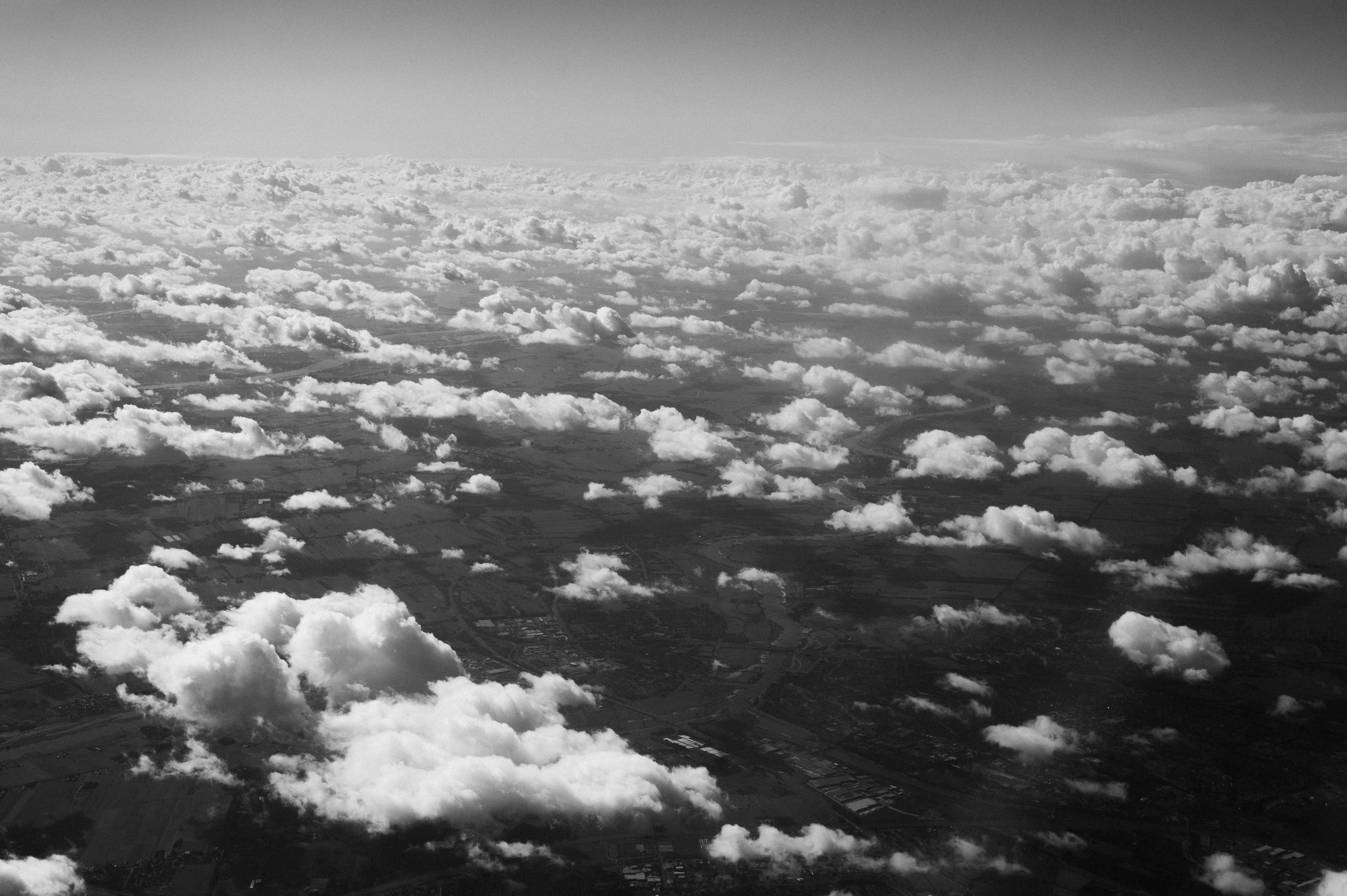 Black and White Aerial View of Cloud Patterns Over Land