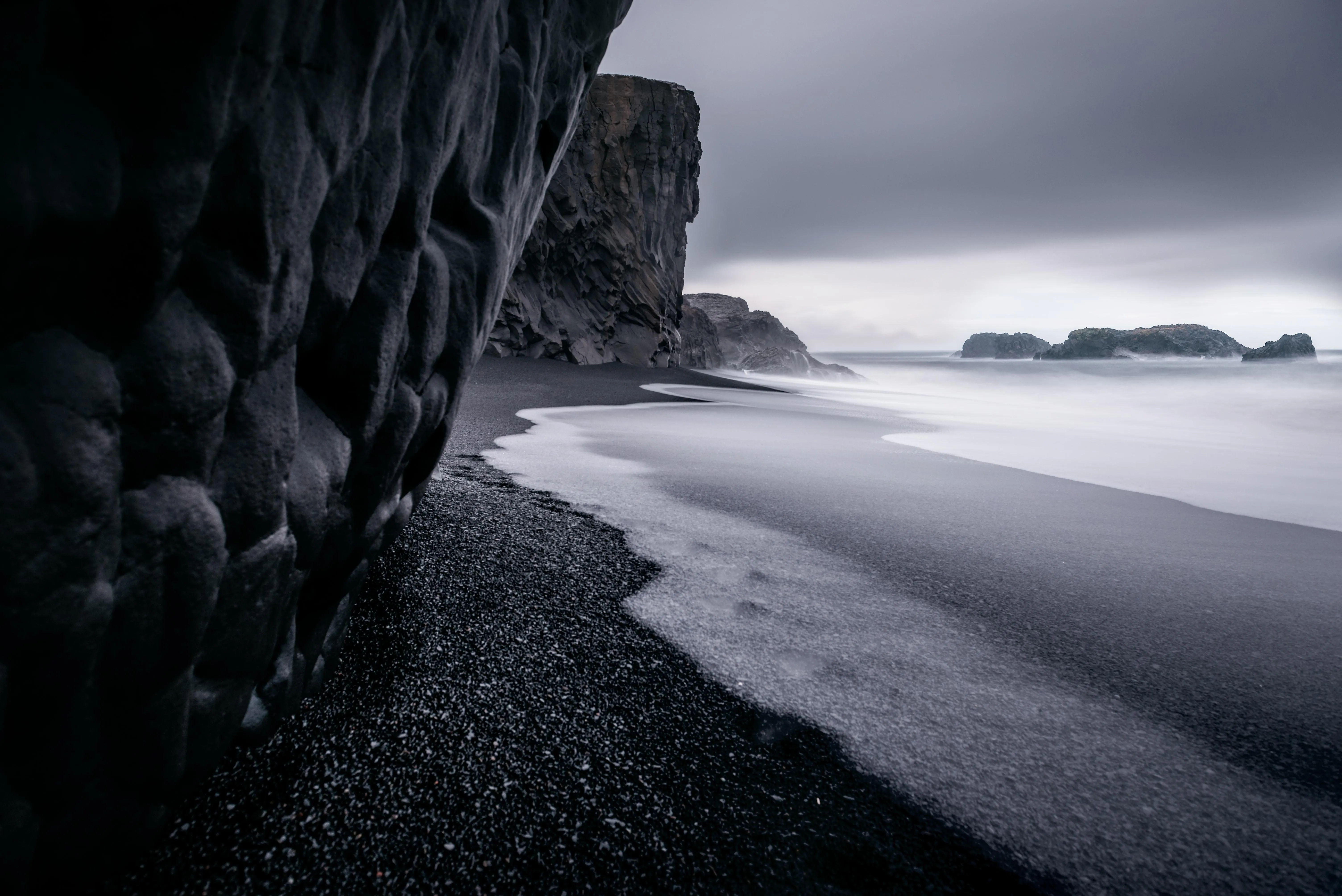 Black and White Beach with Rocks and Ocean Waves image