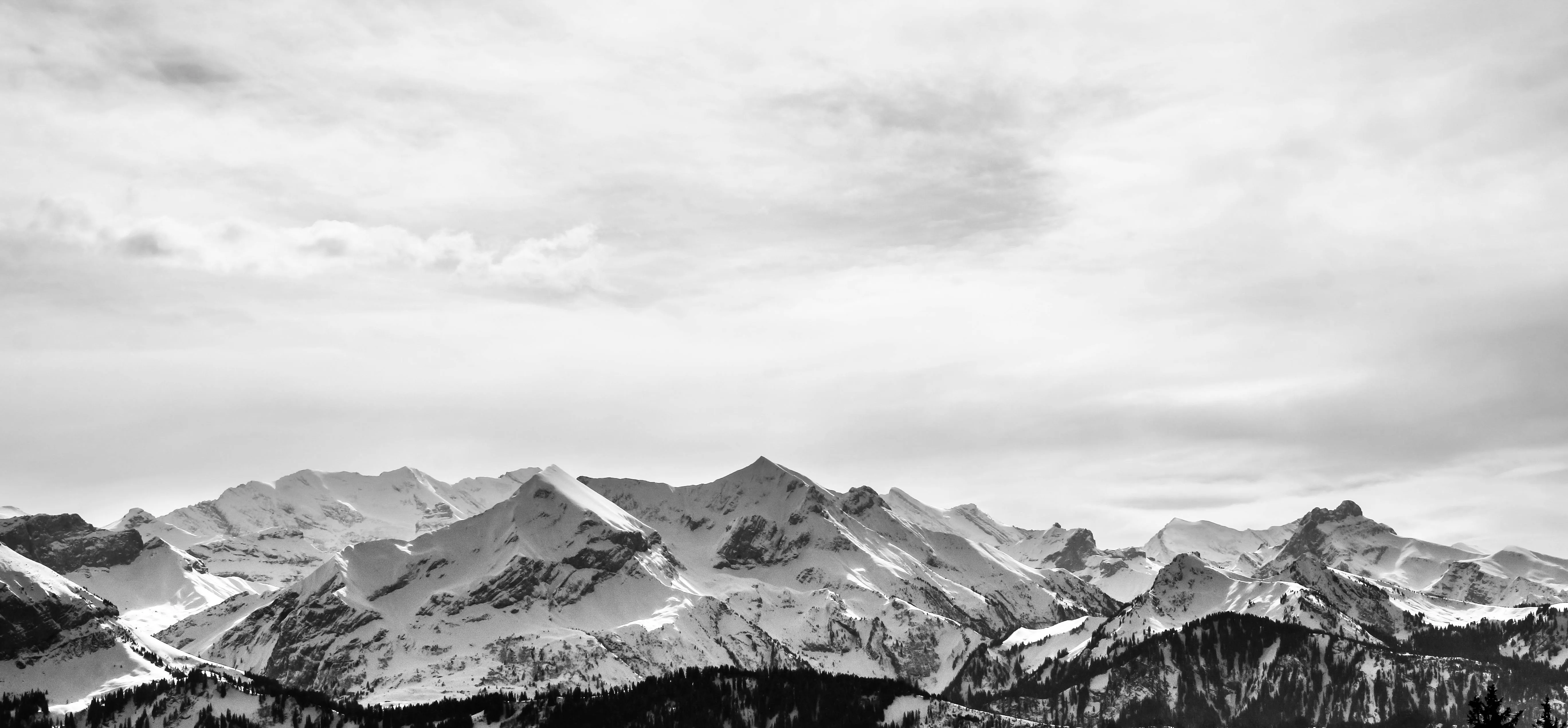 Black and White Mountains with Scattered Clouds Wallpaper