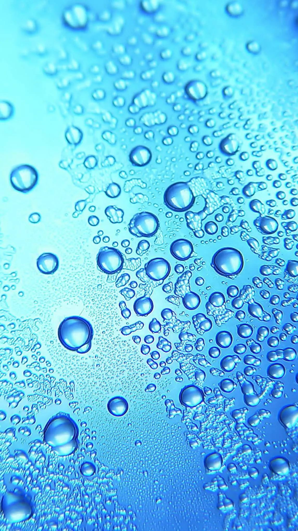 Blue Light Shining Through Window with Raindrops