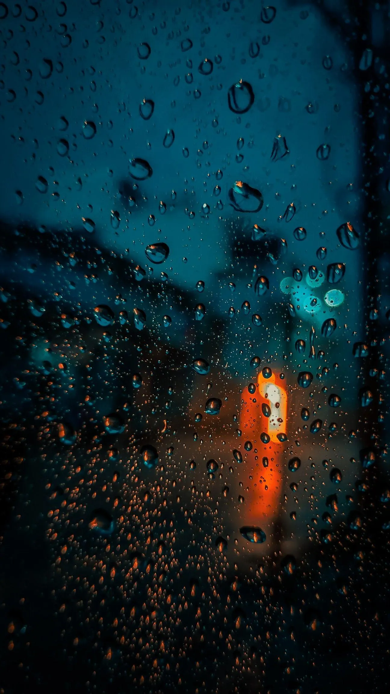 Blue Neon Light Reflecting on Wet Urban Surface