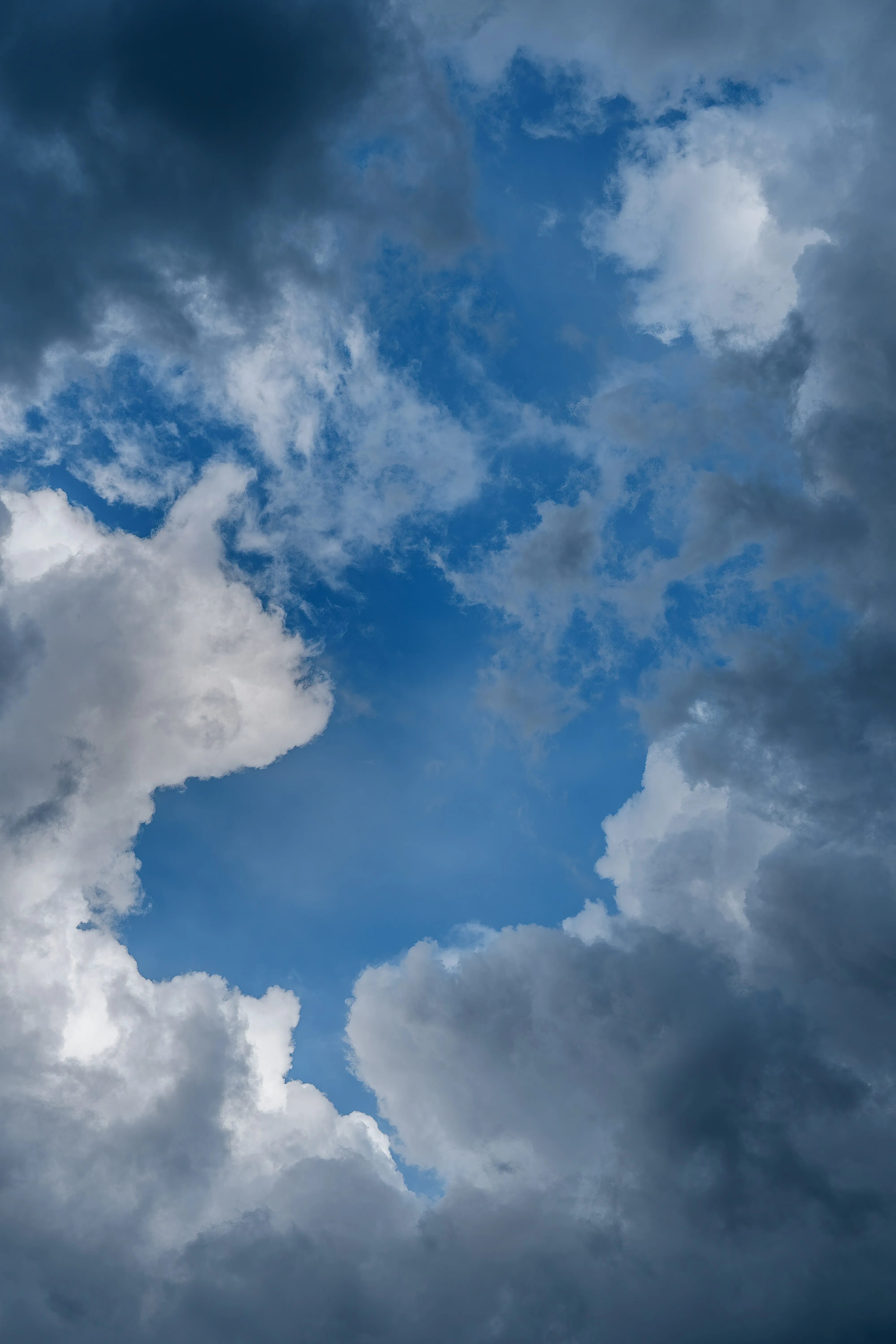Blue Sky with Fluffy White Clouds and Sunlight HD Image