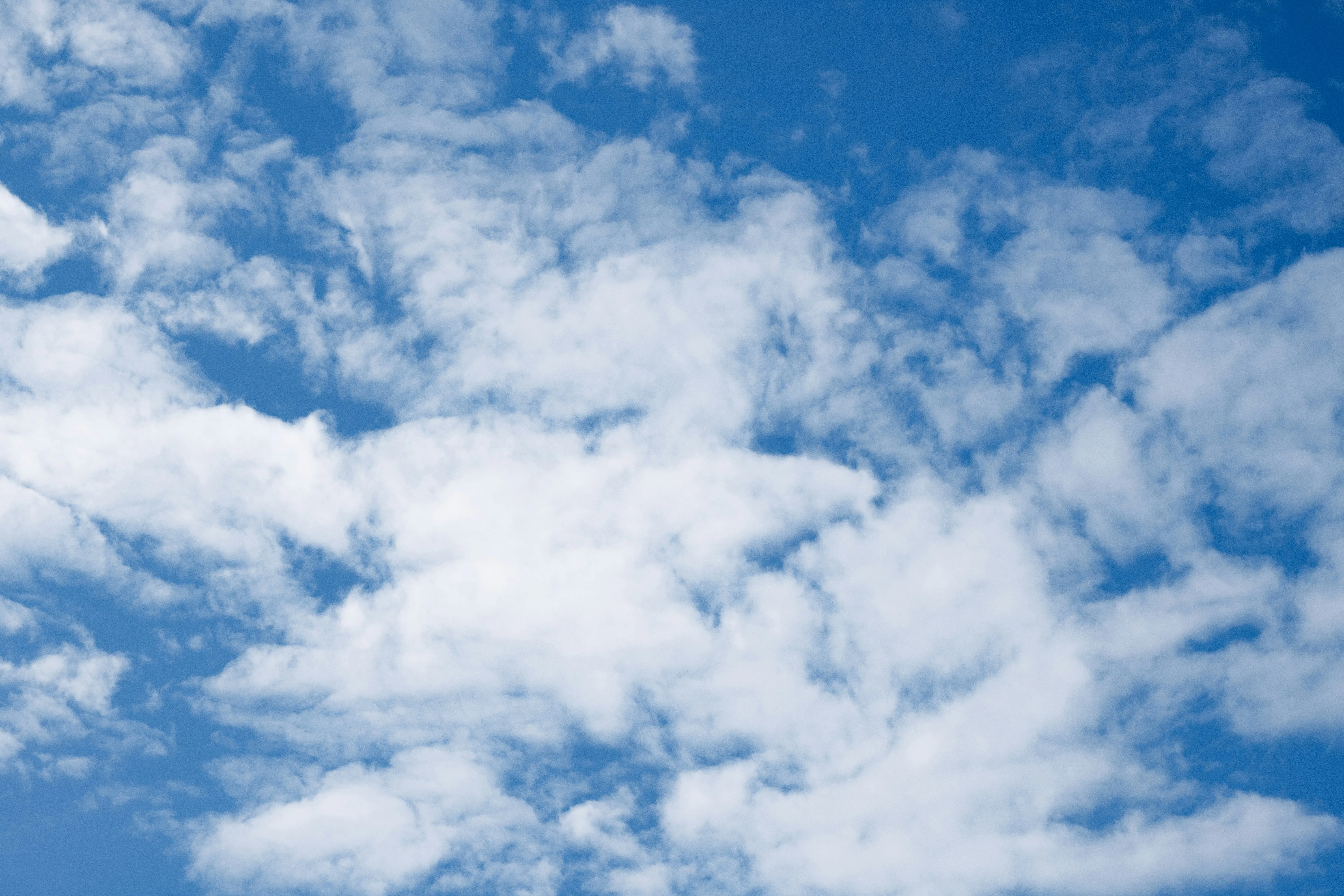 Blue Sky with Scattered Clouds in Midday Sunshine Image