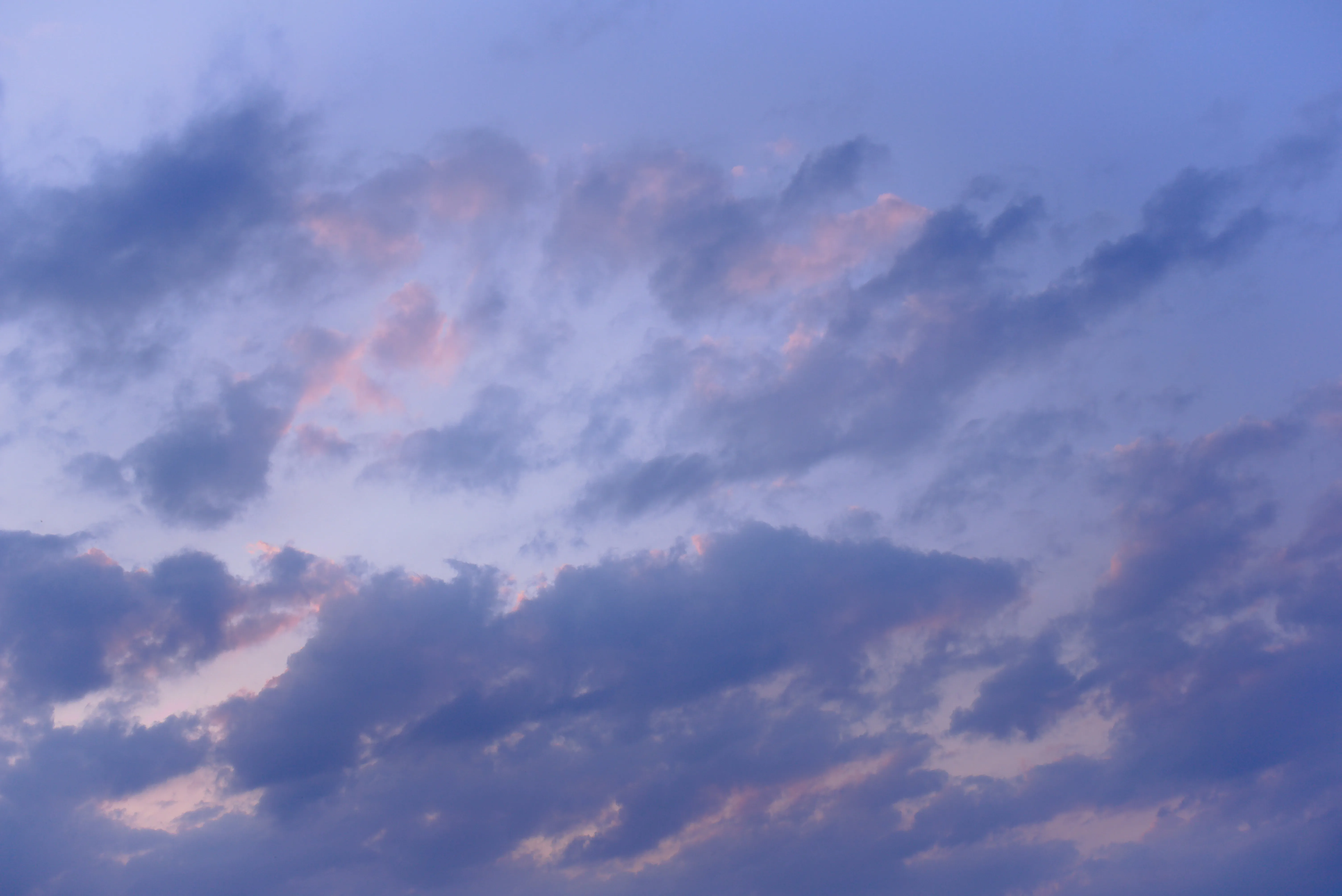 Blue Sky with Soft Purple and Pink Clouds at Sunset