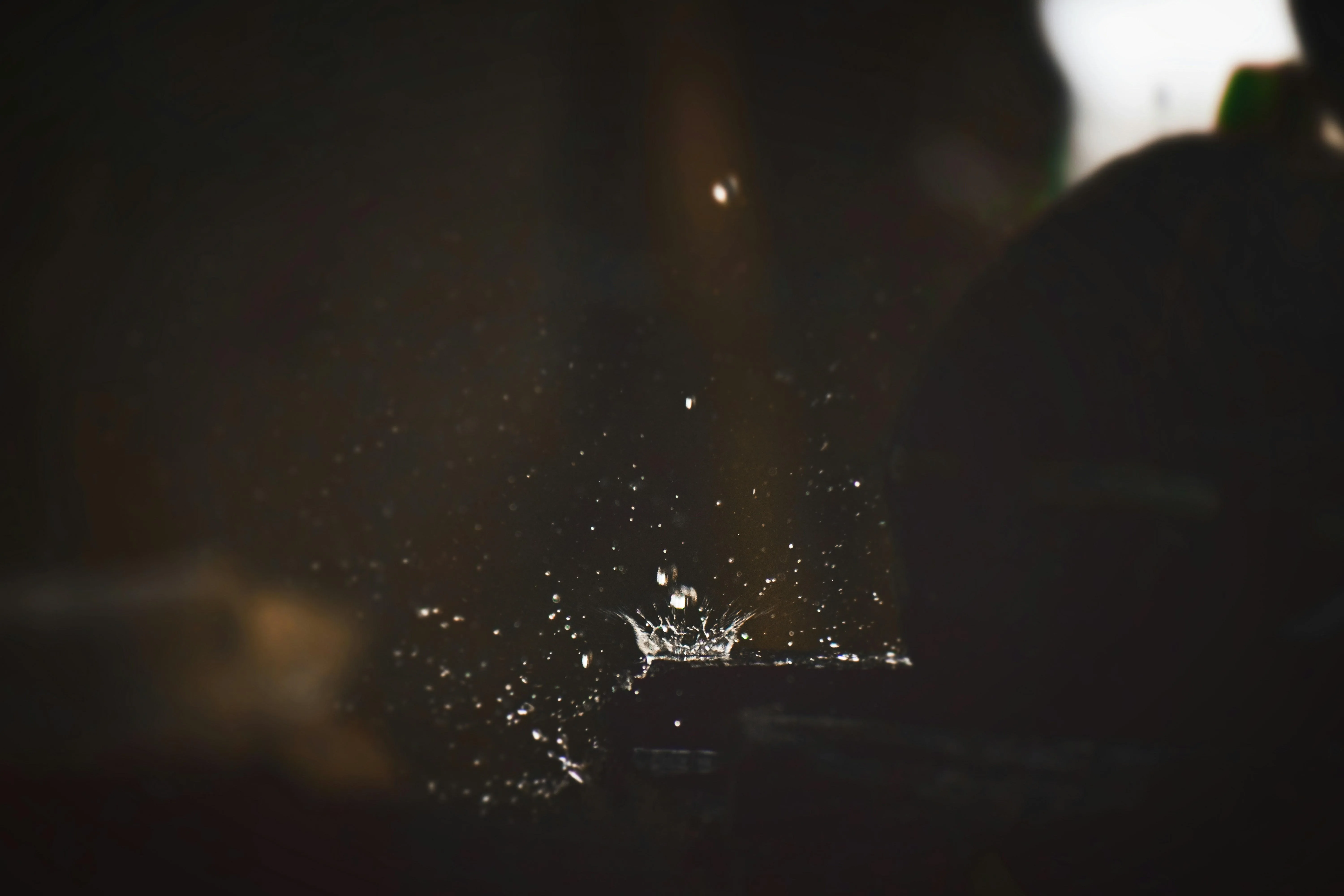 Blurred Dark Rainy Night Scene with Light Reflections