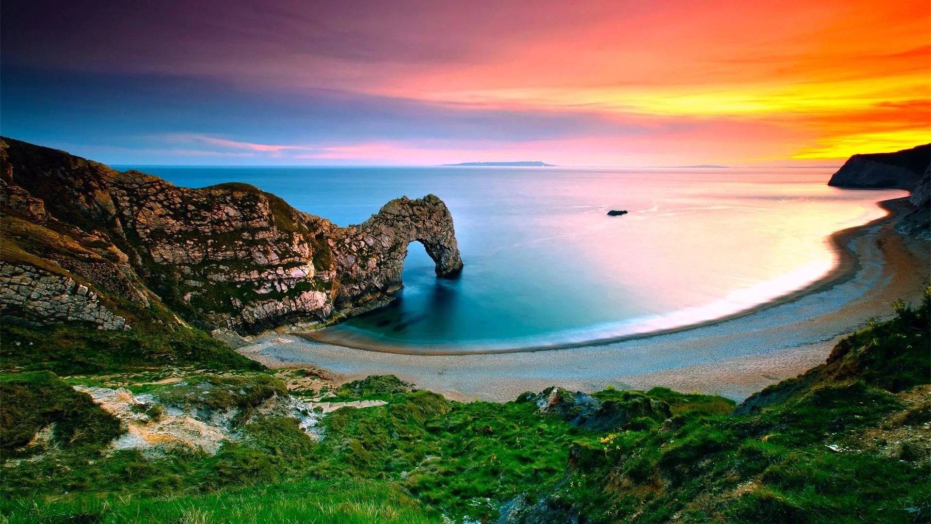 Breathtaking sunset over a sea arch rock formation