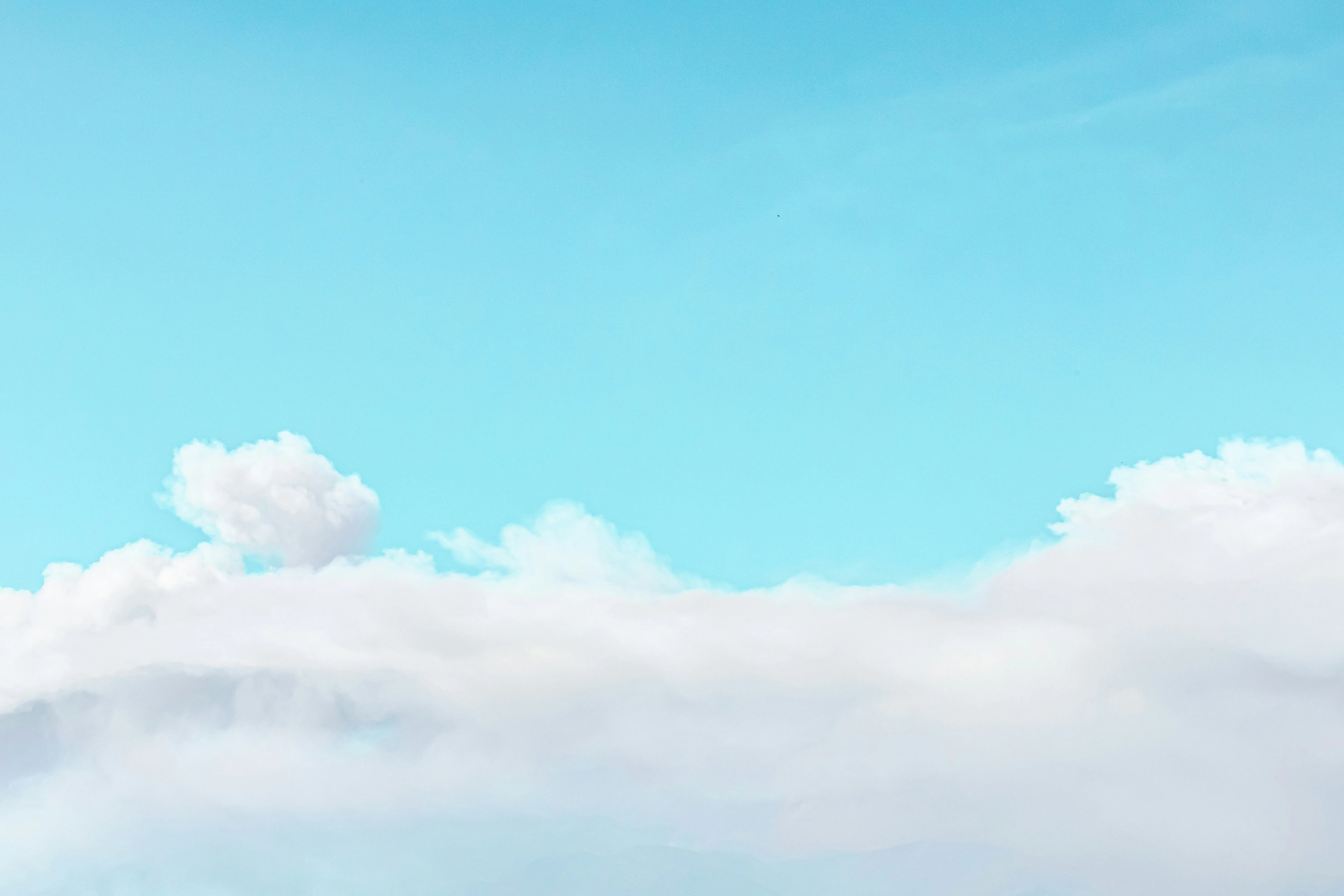 Bright Blue Sky with Large Fluffy White Clouds in Daylight