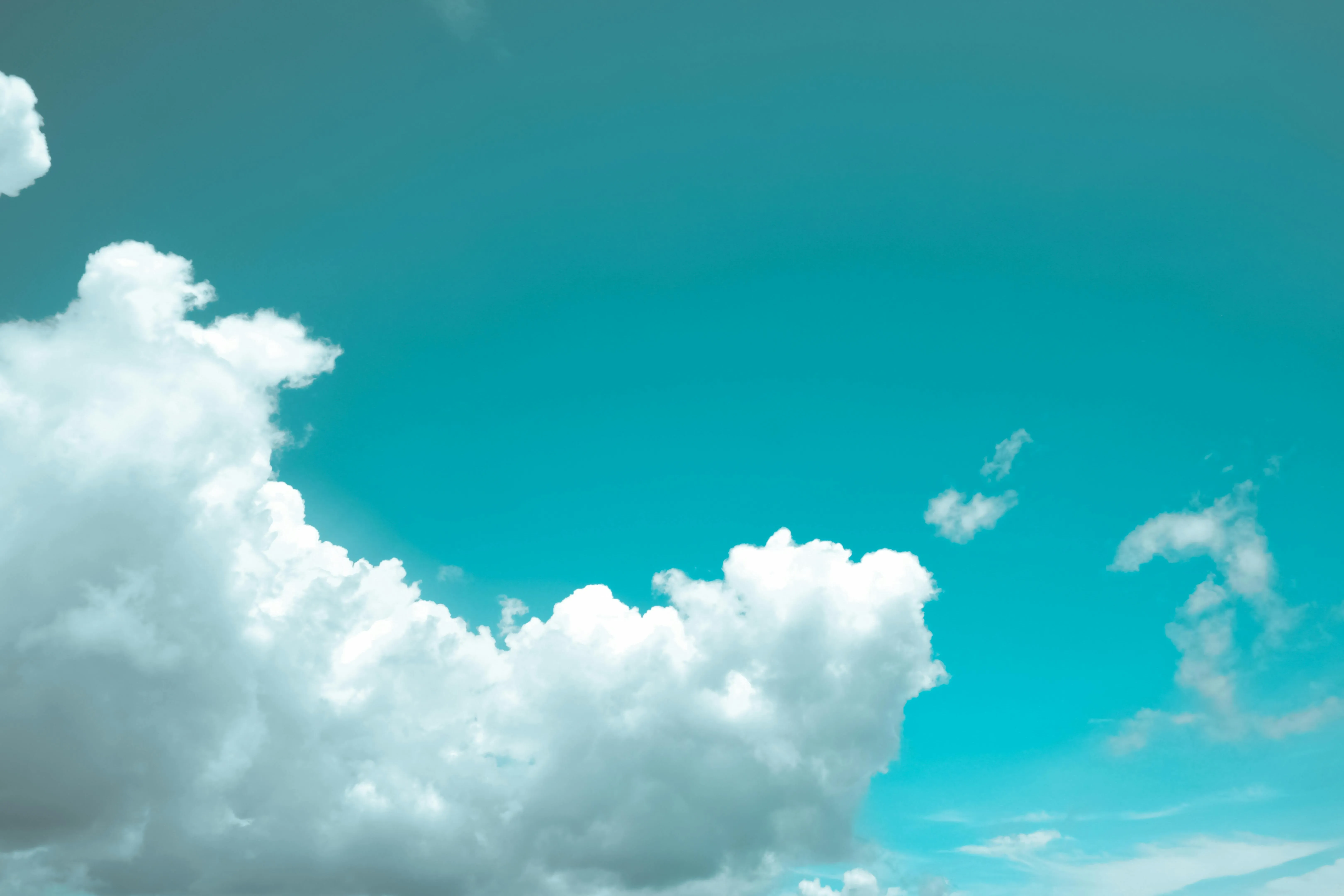 Bright Blue Sky with Large Fluffy White Clouds Wallpaper