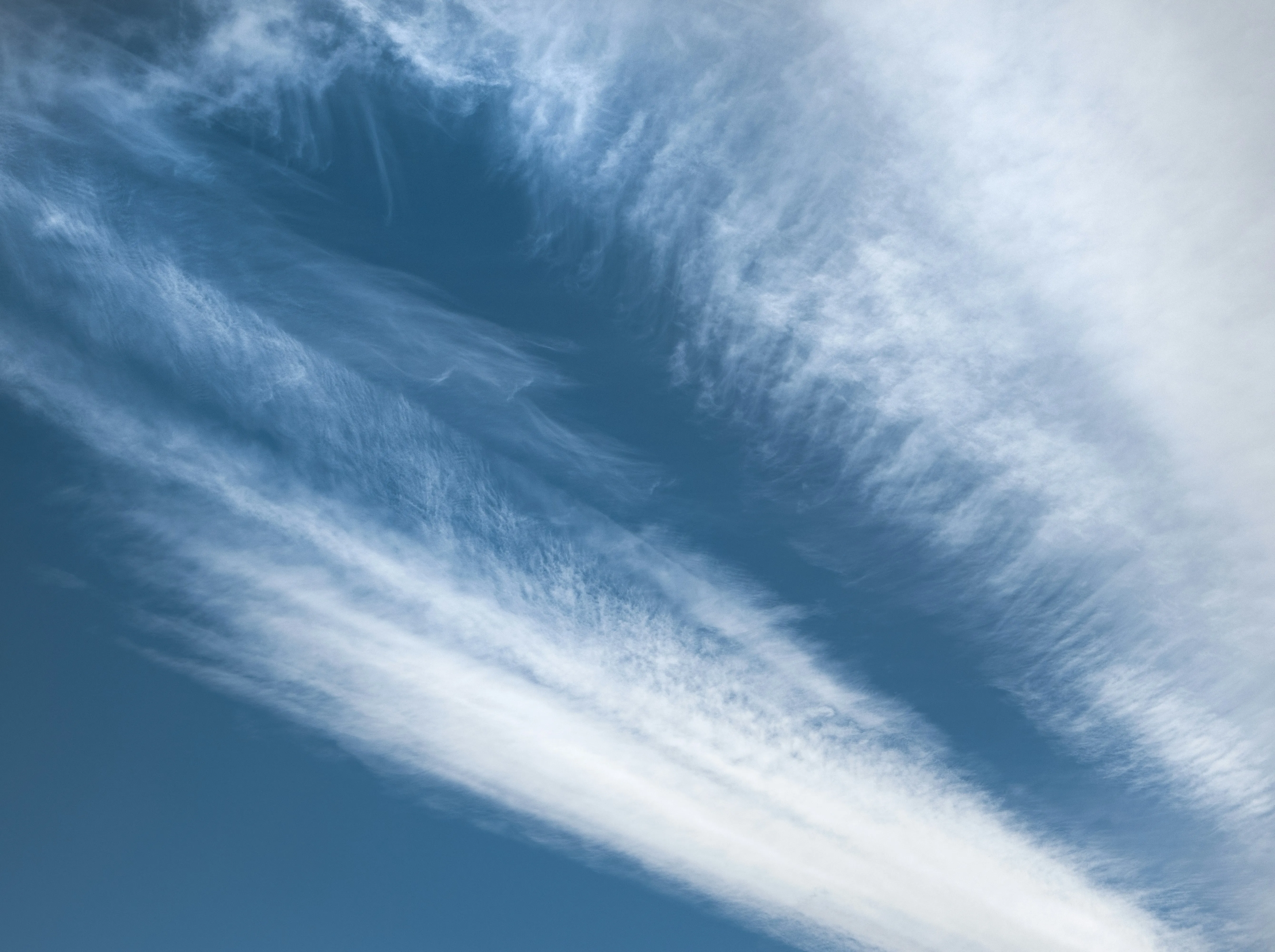 Bright Blue Sky with Long Streaks of Wispy Cirrus Clouds
