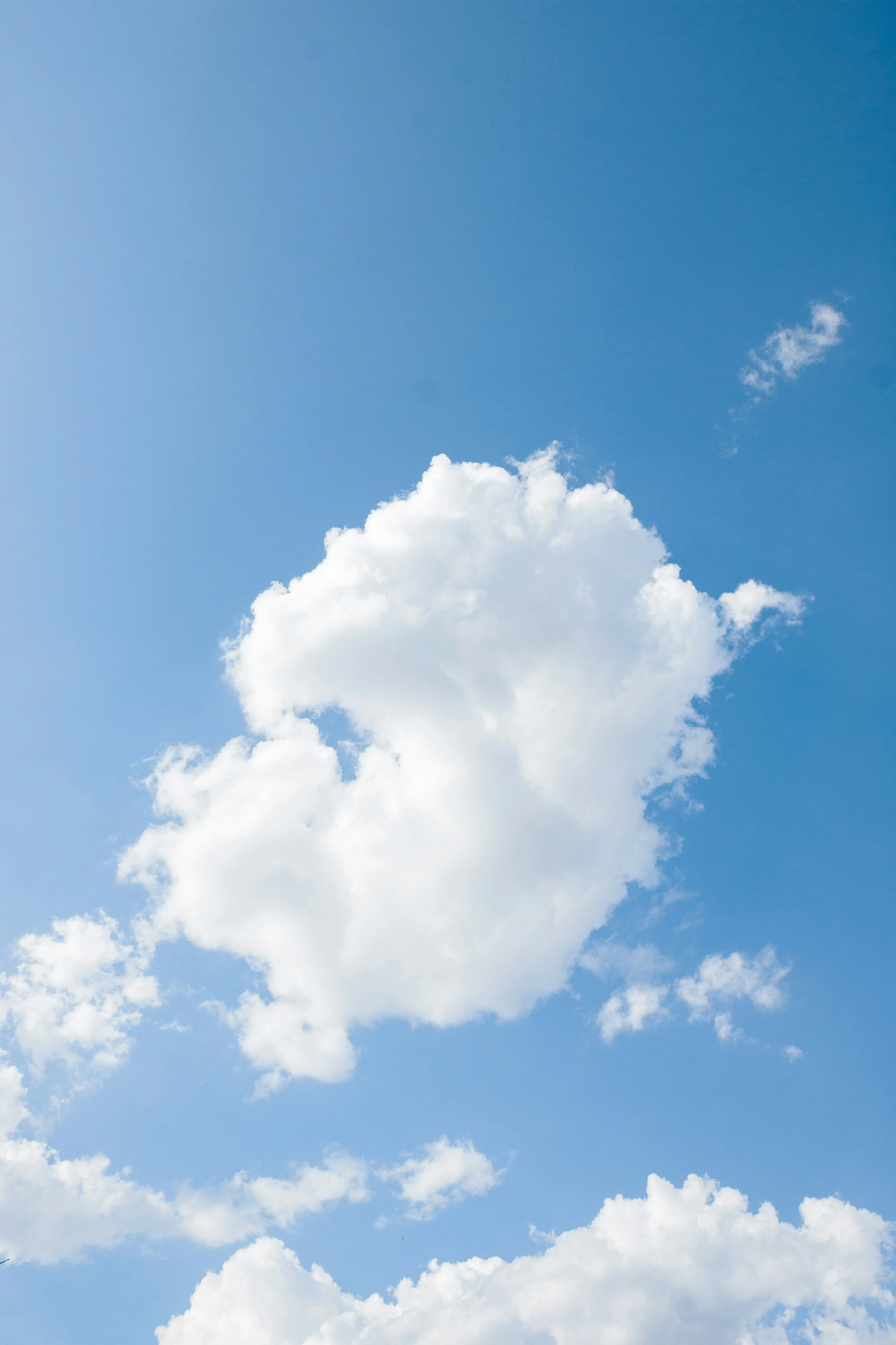 Bright Blue Sky with White Puffy Clouds on Clear Day