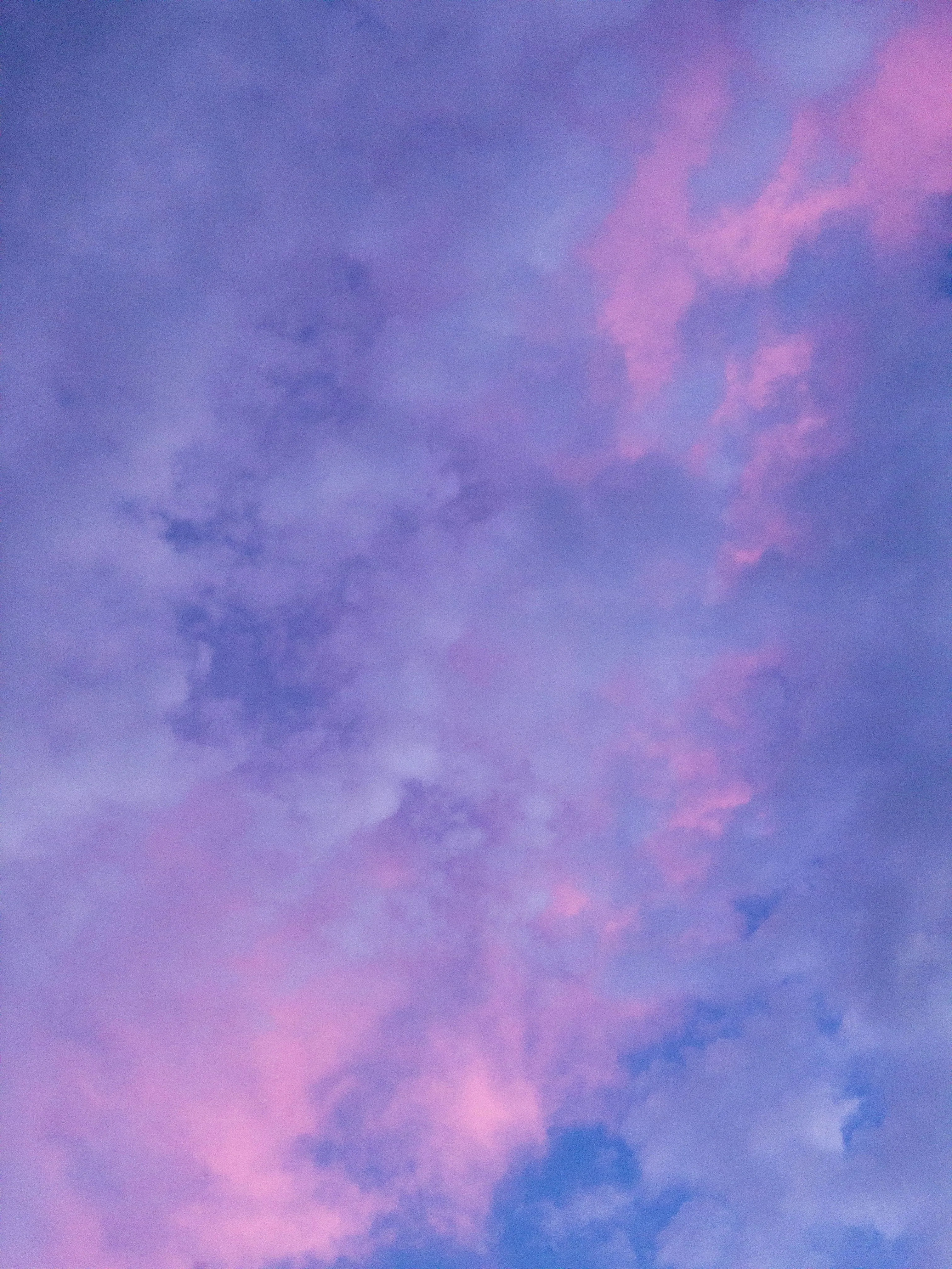 Bright Purple and Pink Clouds in Blue Sky Scene Image