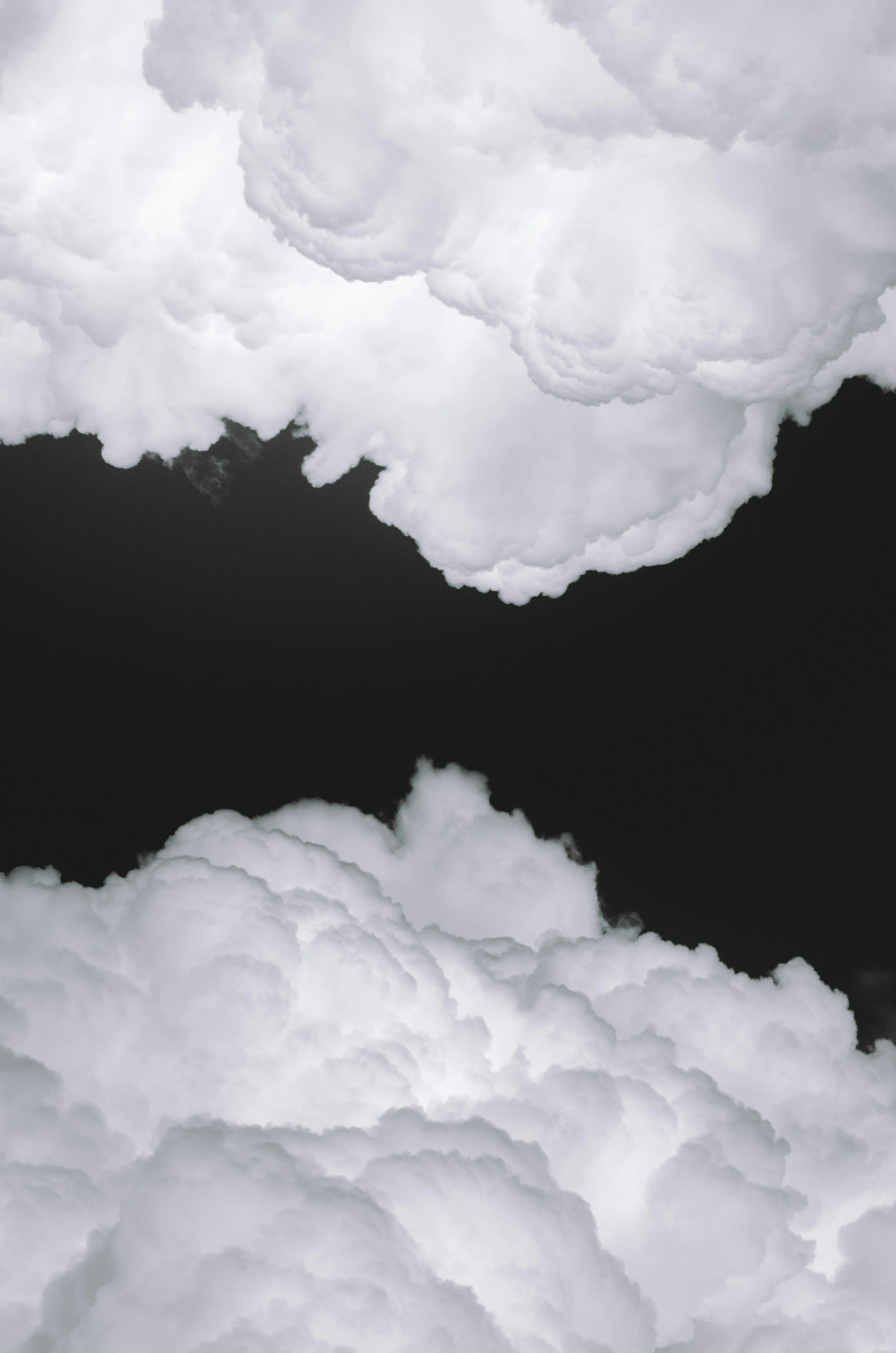 Bright White Clouds in Black Sky on a Dramatic Background