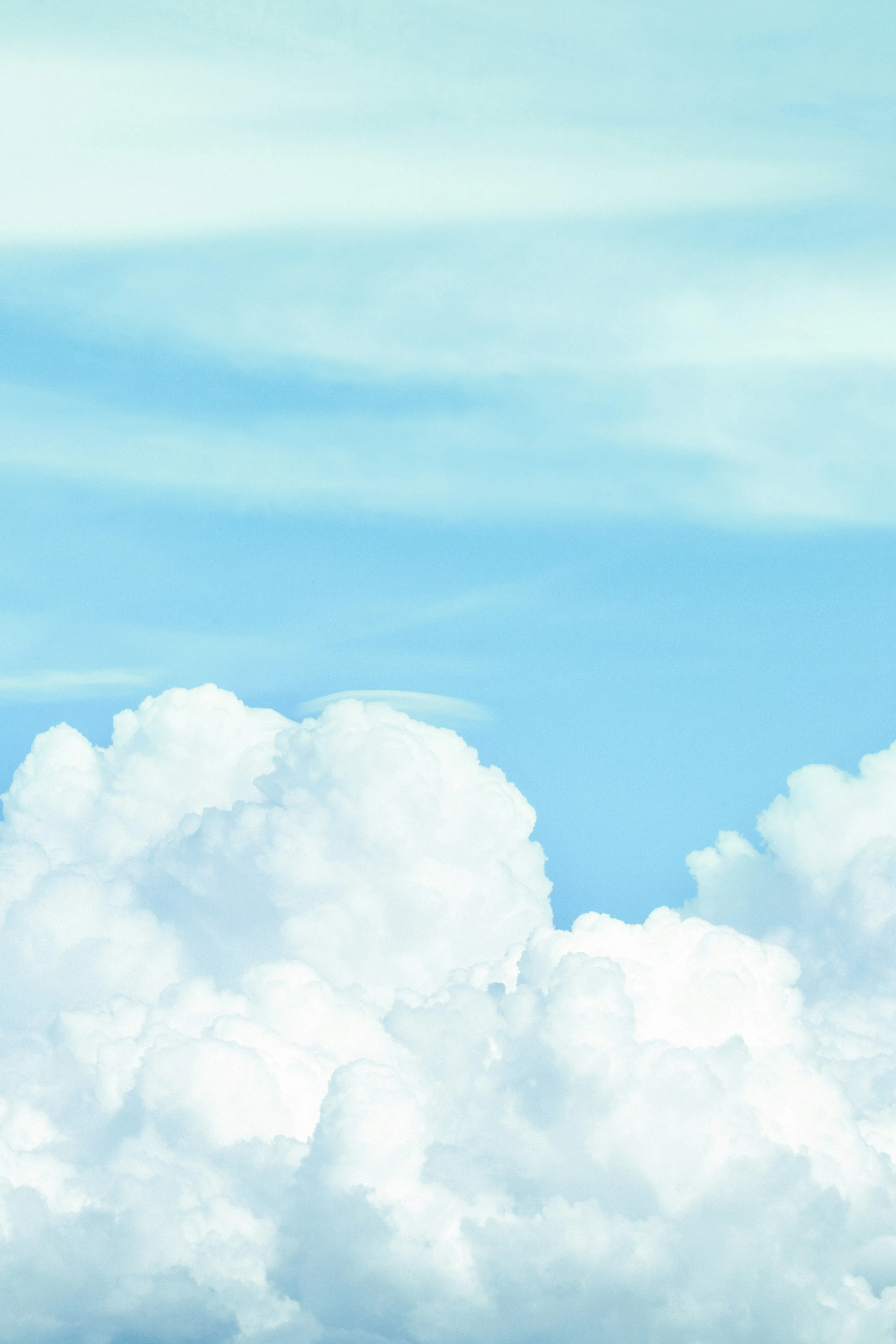 Bright White Puffy Clouds in Light Blue Sky Wallpaper 4K