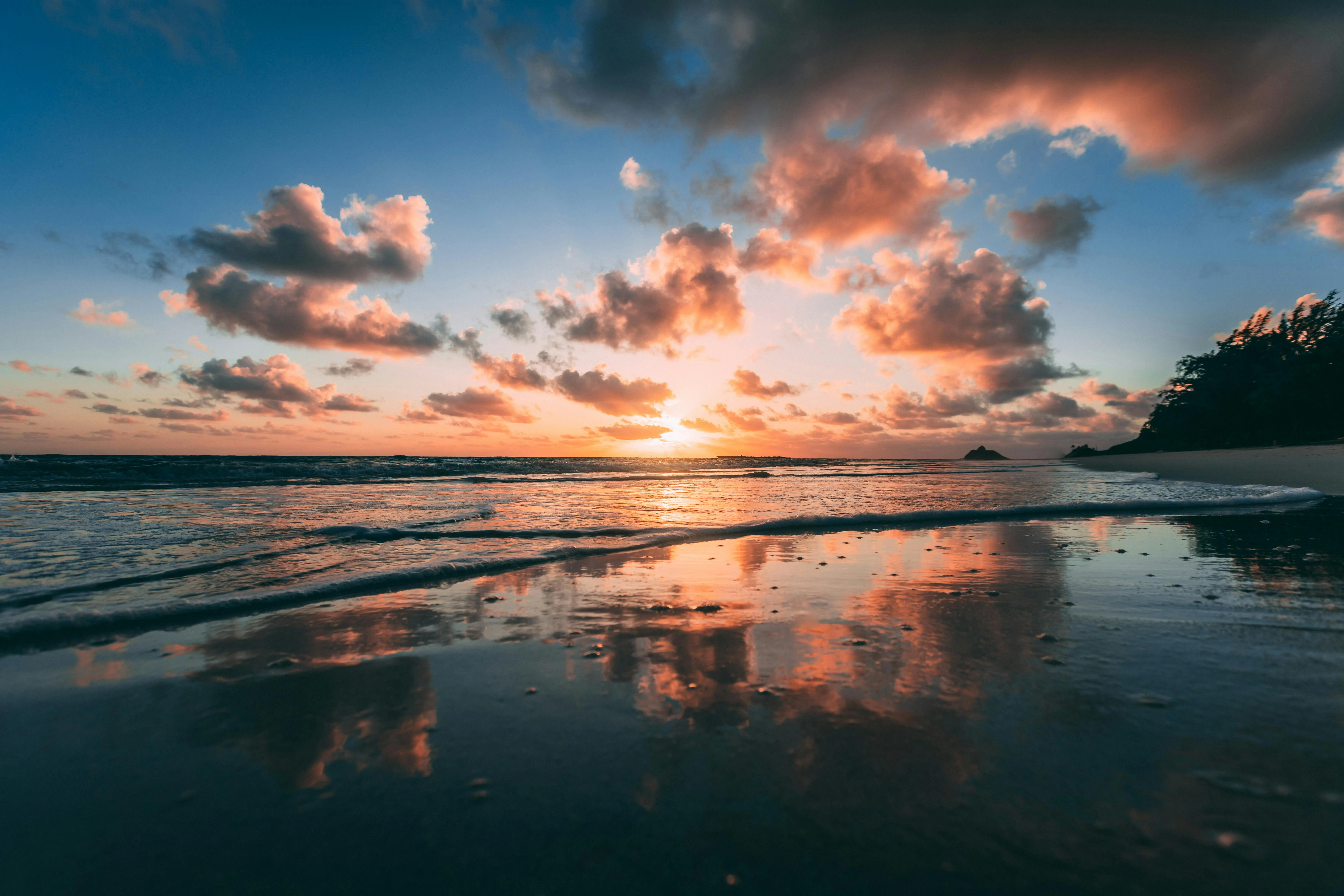 Calm Ocean Reflection with Colorful Clouds at Sunset