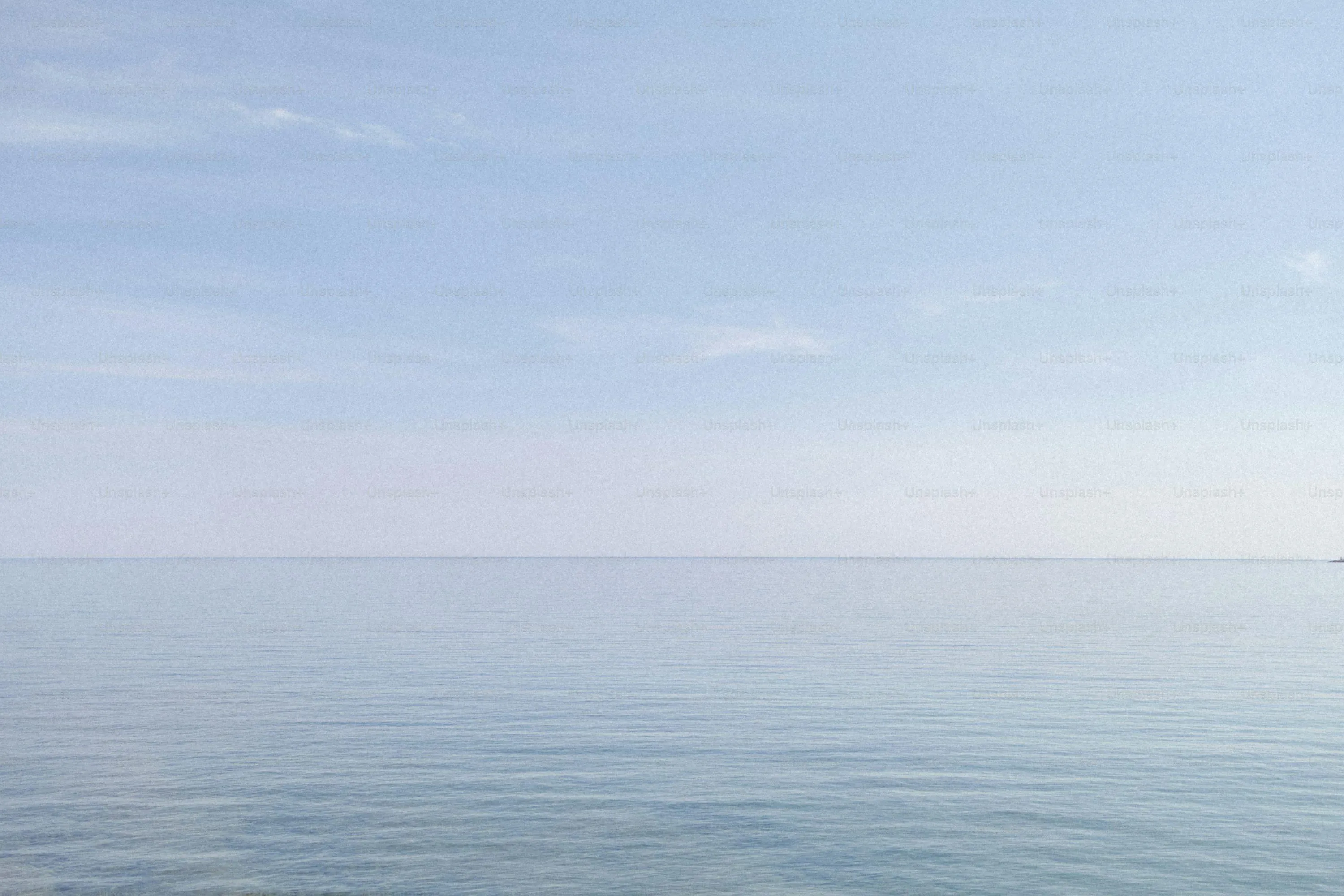 Calm sea and sky horizon with soft blue colors image