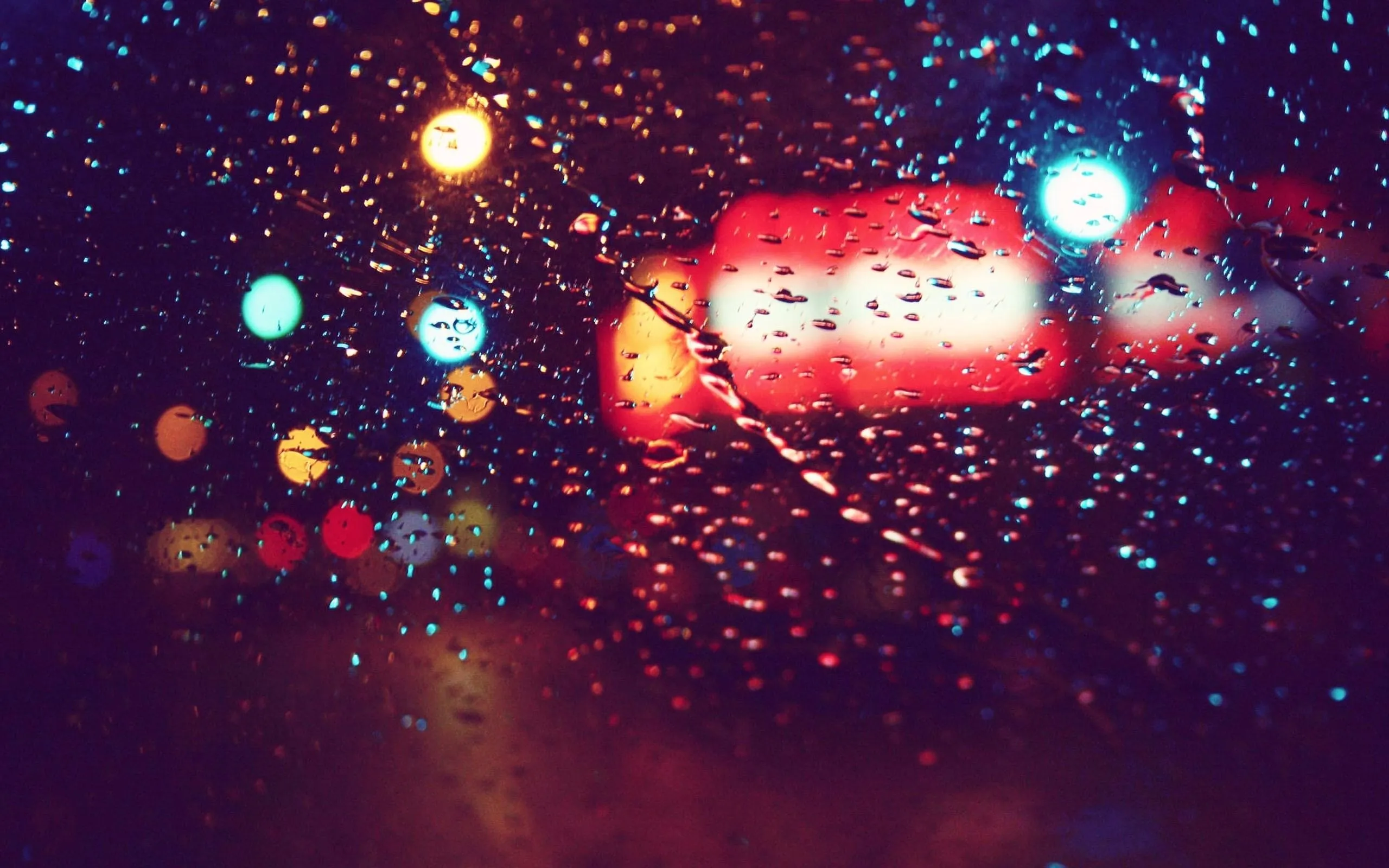 Car Taillights Blurred By Heavy Rain at Night Wallpaper