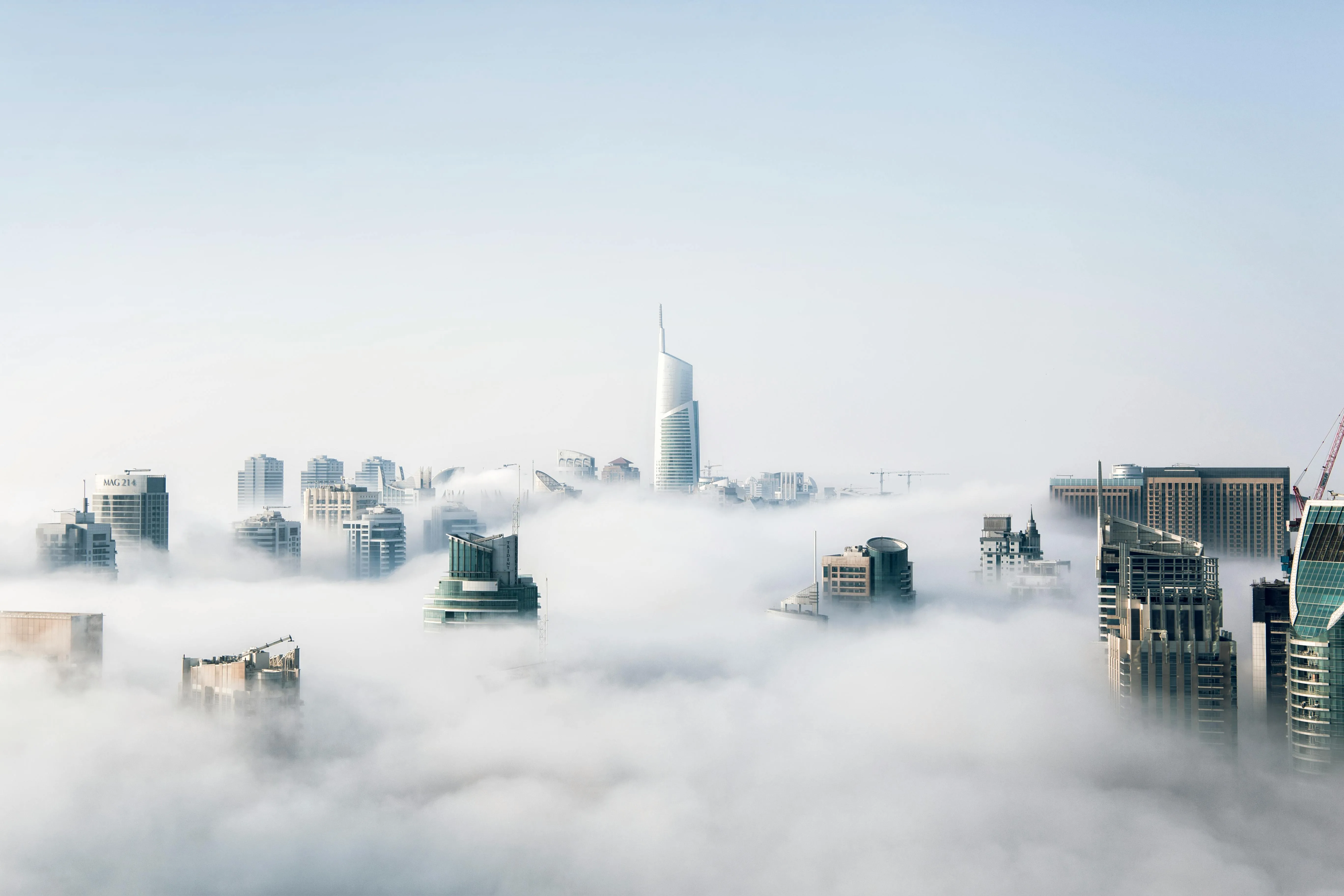 City Skyline Above Thick Layer of Floating Clouds Image