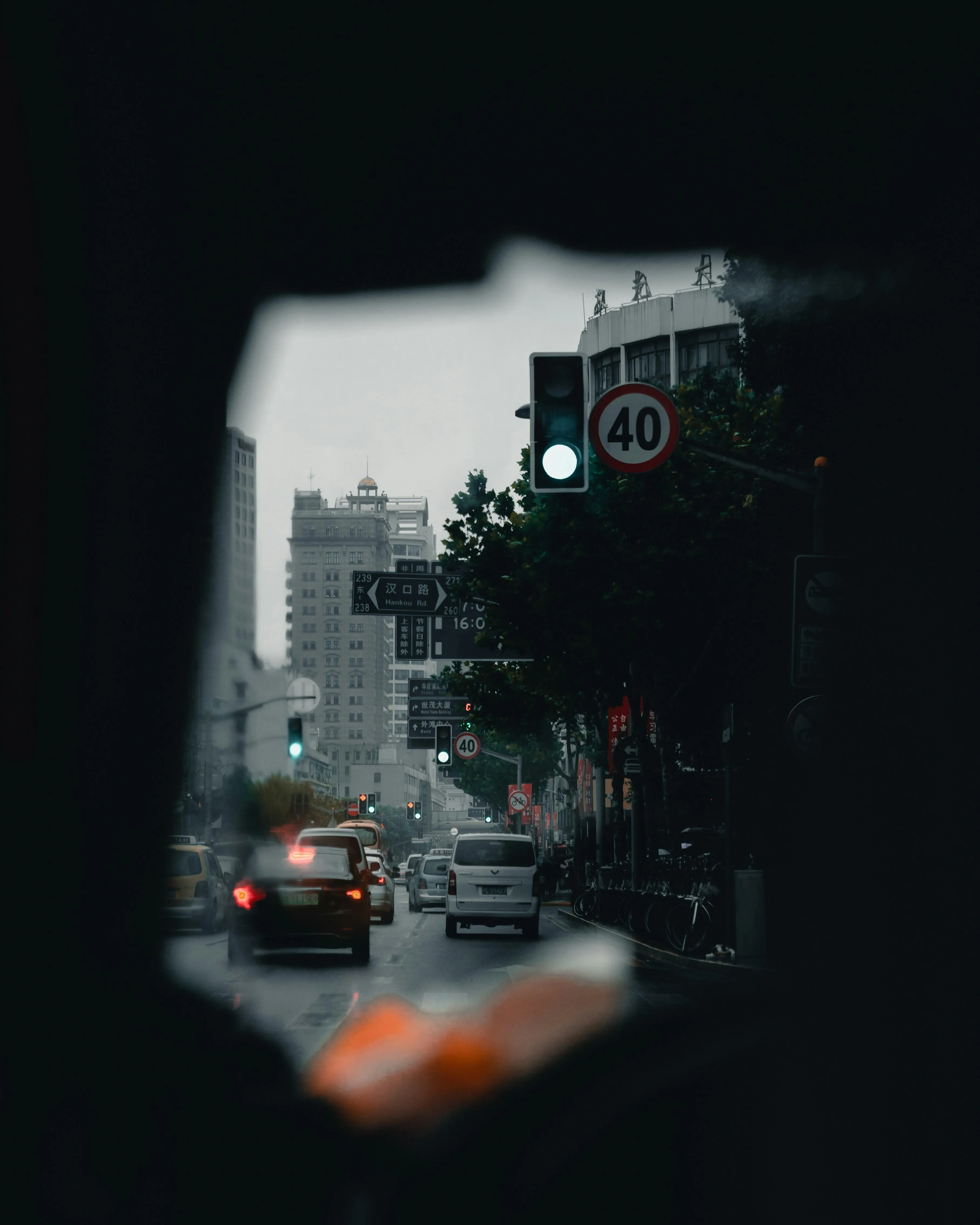 City Street at Night with Rain and Illuminated Signs