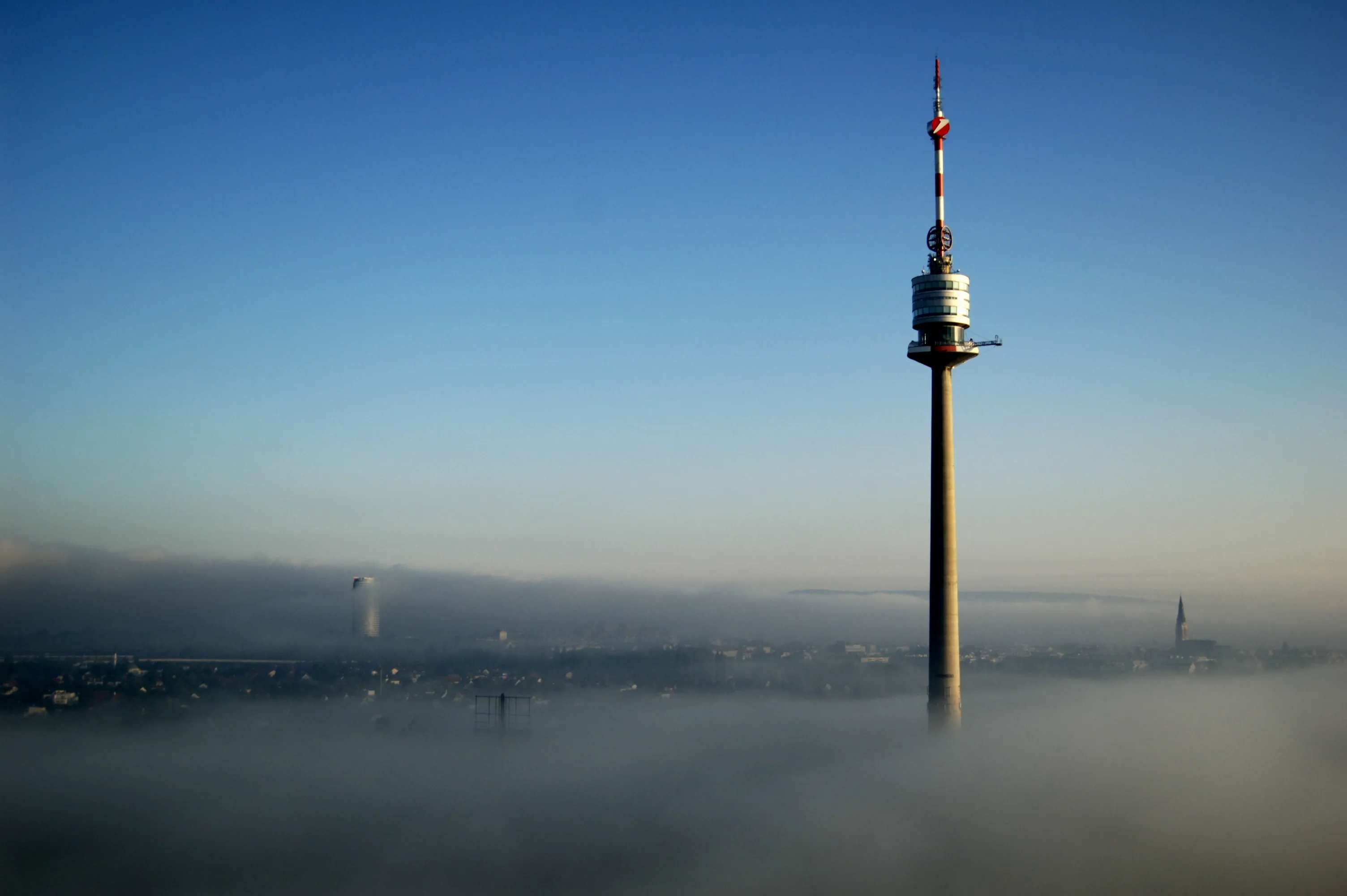City Television Tower Surrounded By Low Hanging Fog