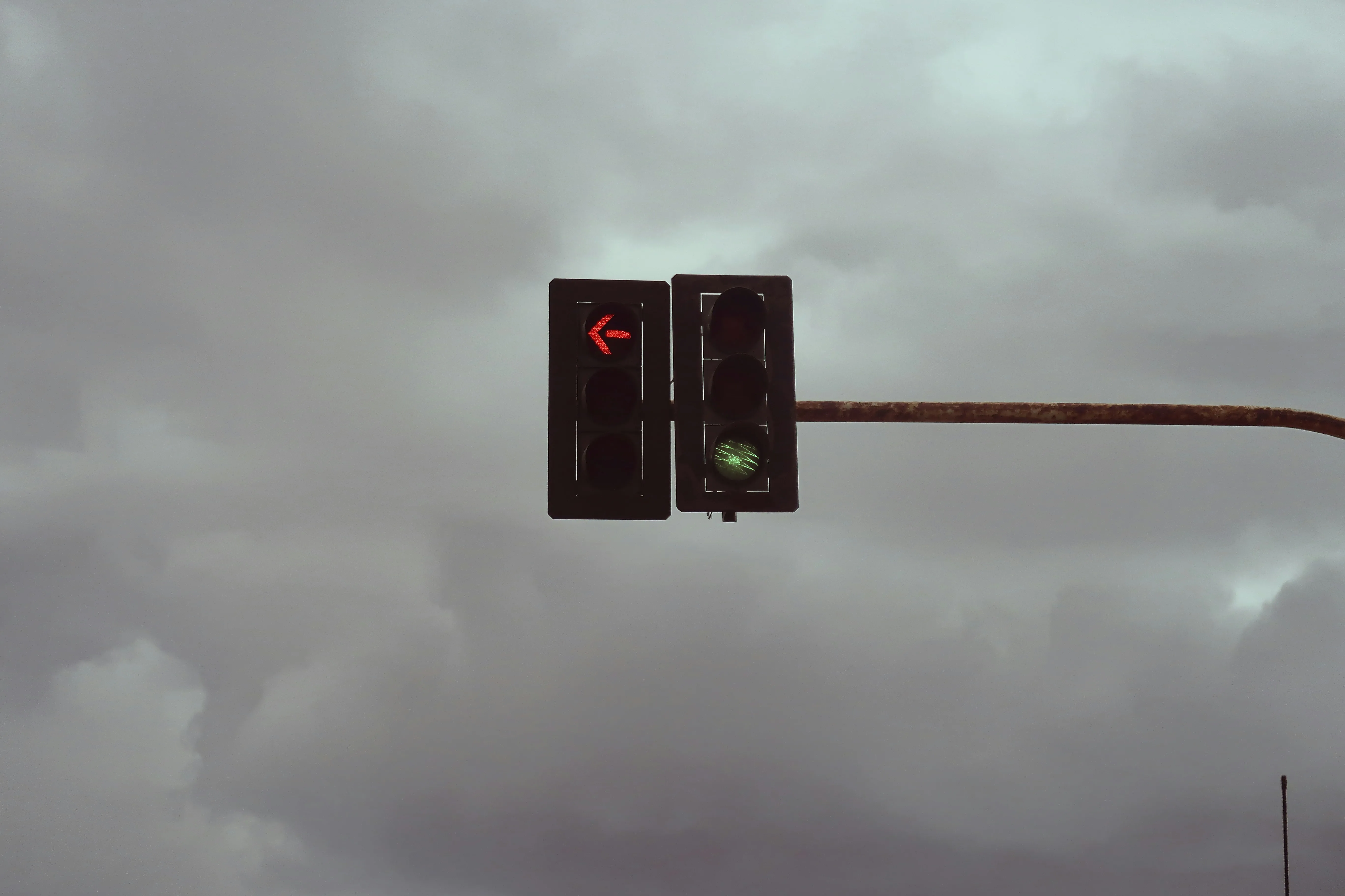 City Traffic Light and Overcast Sky Signaling Stop Image