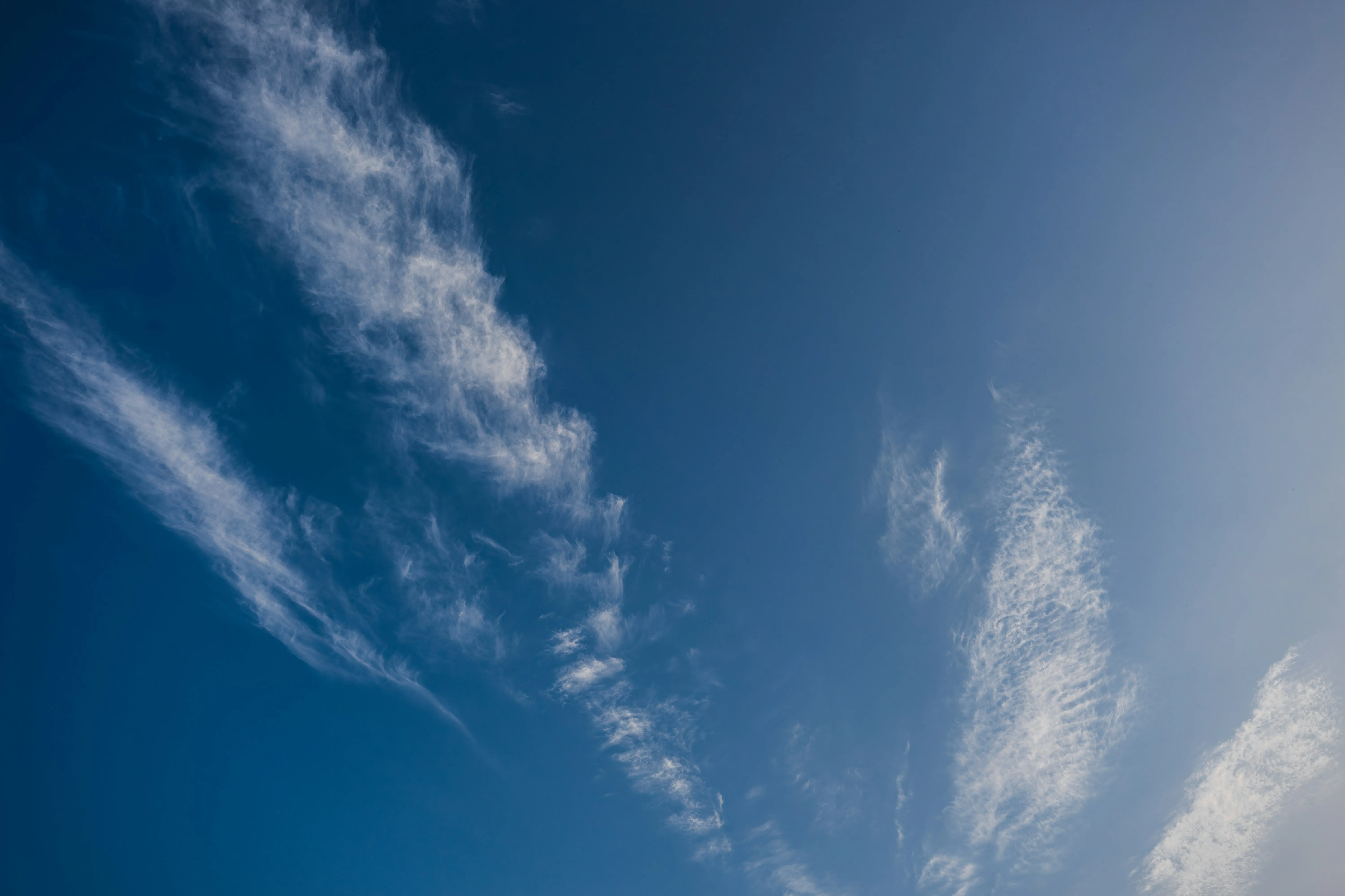 Clear Blue Sky with Light Wispy Clouds on a Bright Day