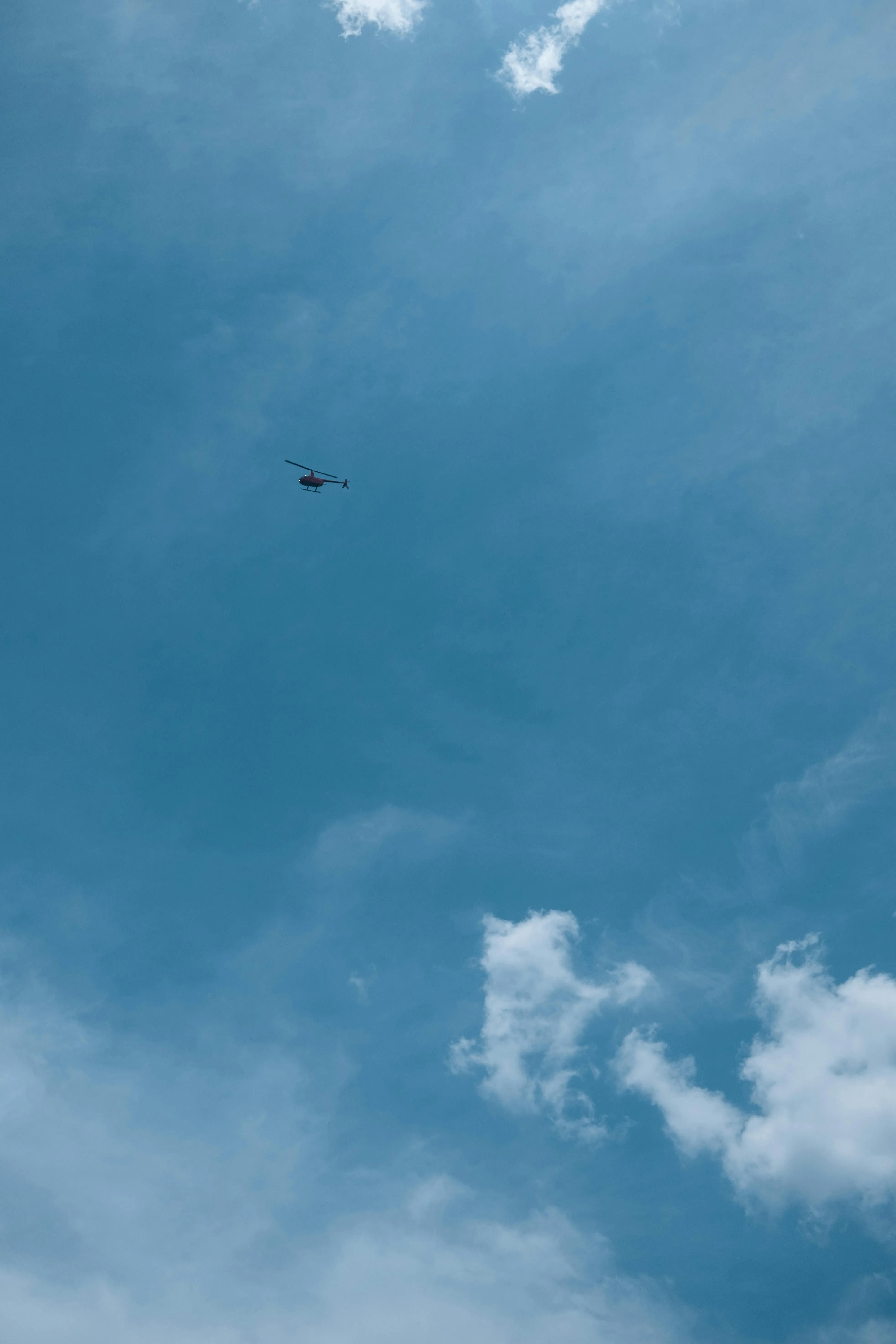 Clear Blue Sky with Tiny Cloud and Helicopter Flying