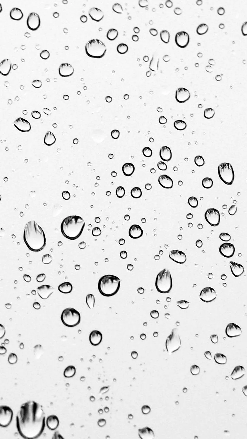Clear Water Droplets on Glass Forming a Pattern Wallpaper
