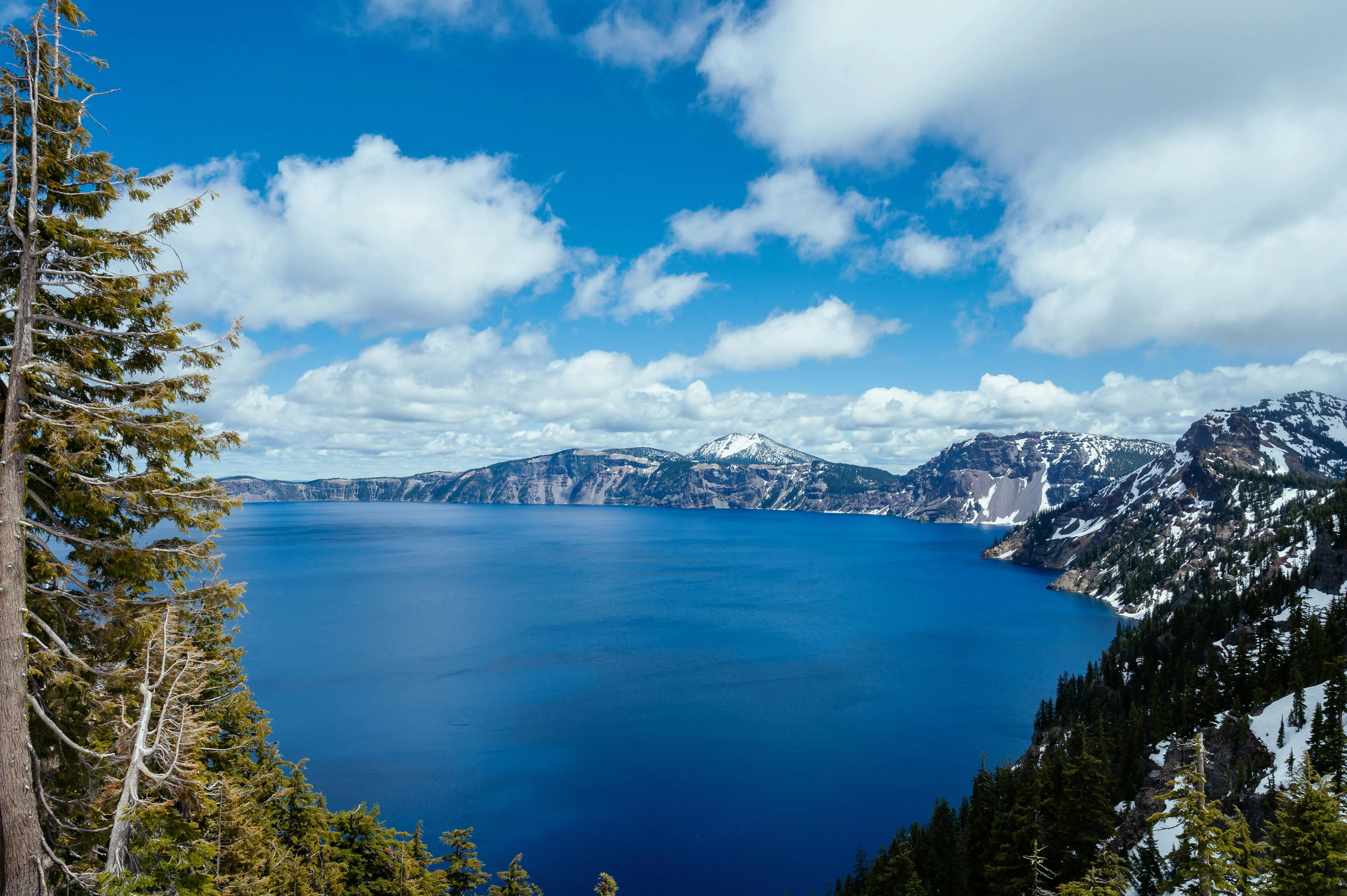 Clear Winter Sky Over Lake and Snowy Mountain Landscape