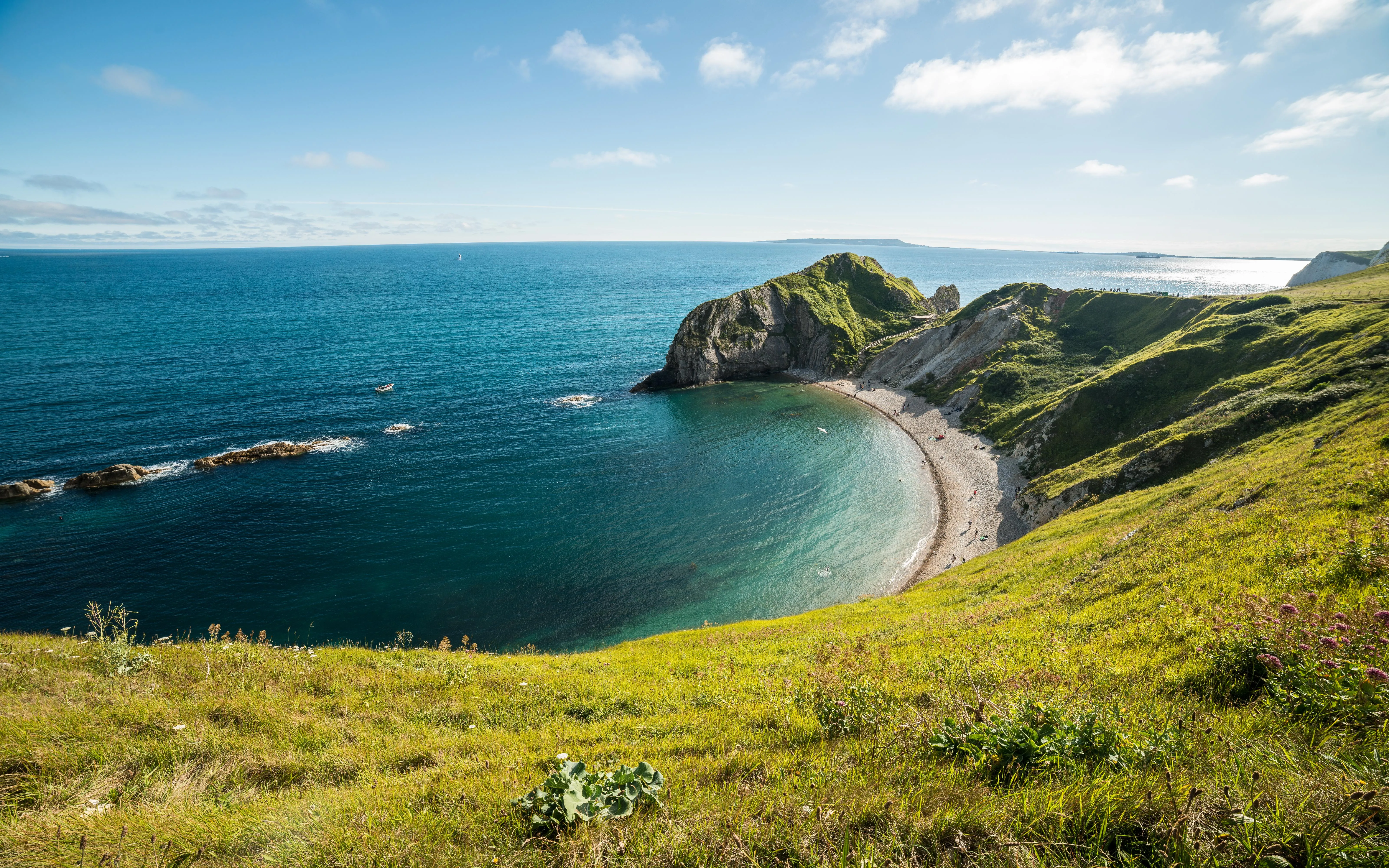 Cliffside Ocean View with Rolling Hills and Blue Waters
