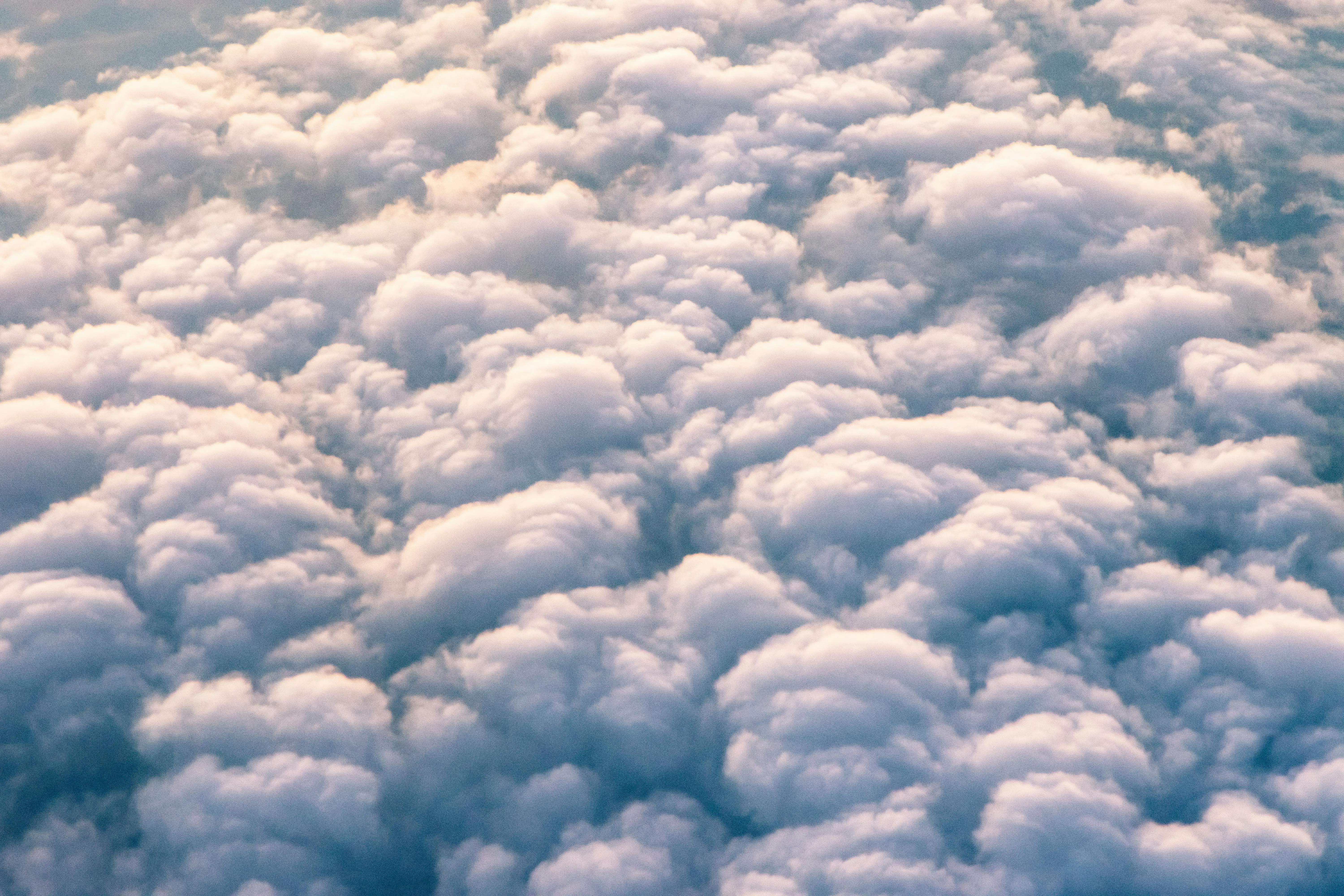 Close Up View of Puffy White Clouds Filling the Entire Sky