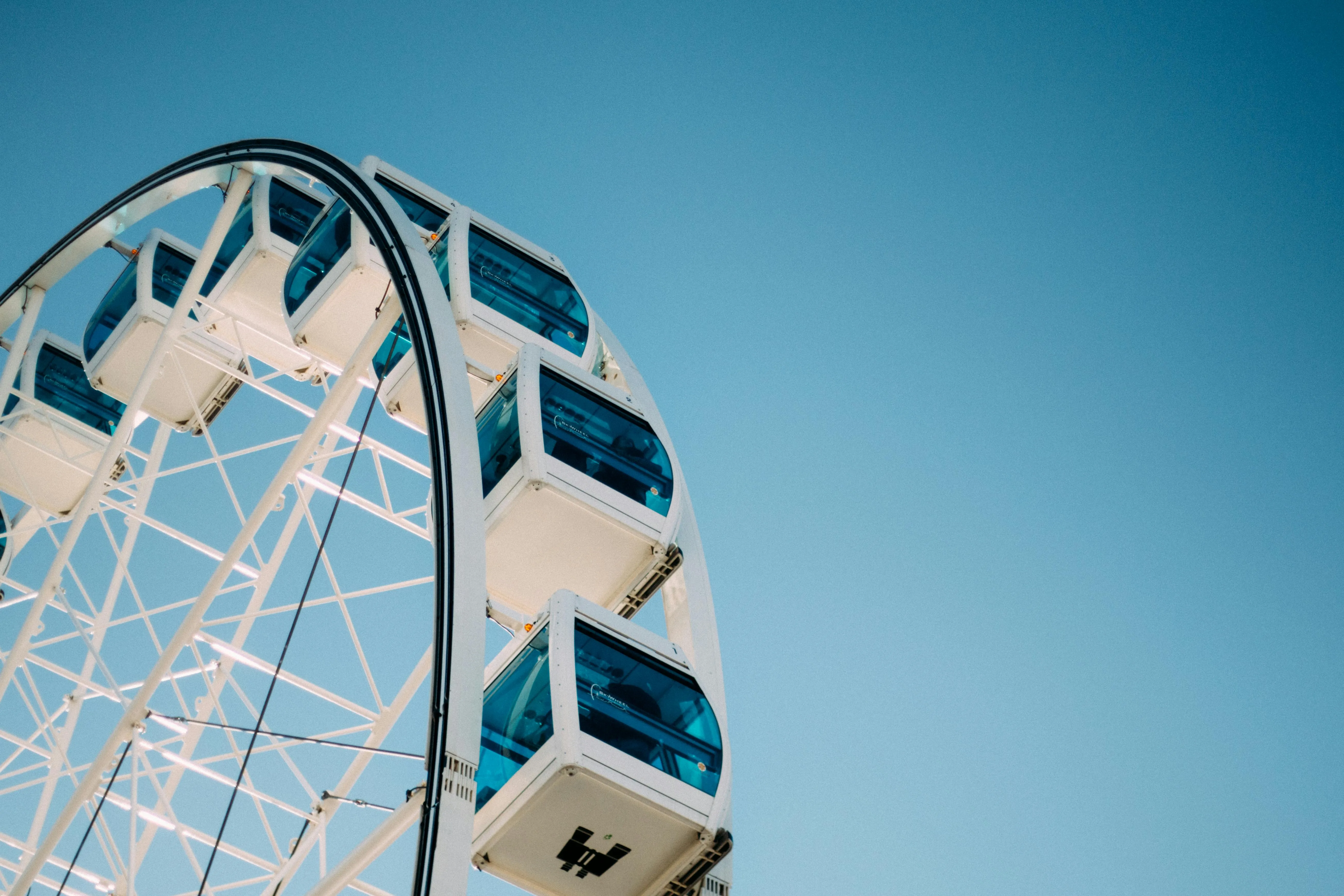 Closeup of a Ferris Wheel with Blue Sky Background HD