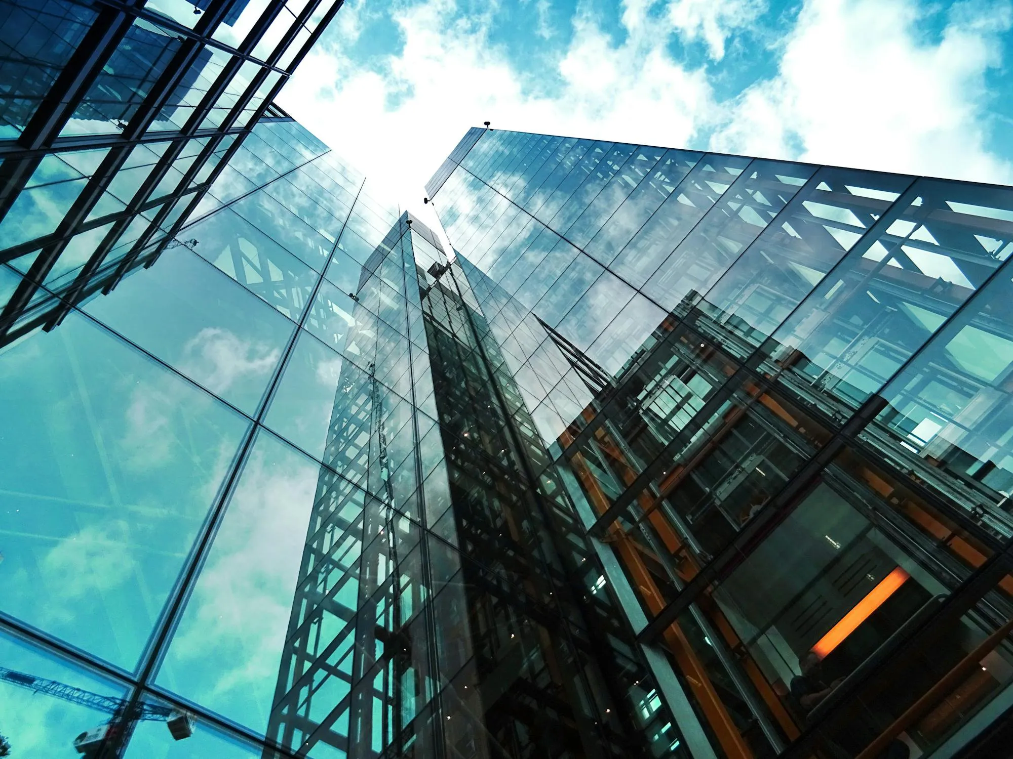 Cloud Reflections on Modern Glass Building Exterior Image