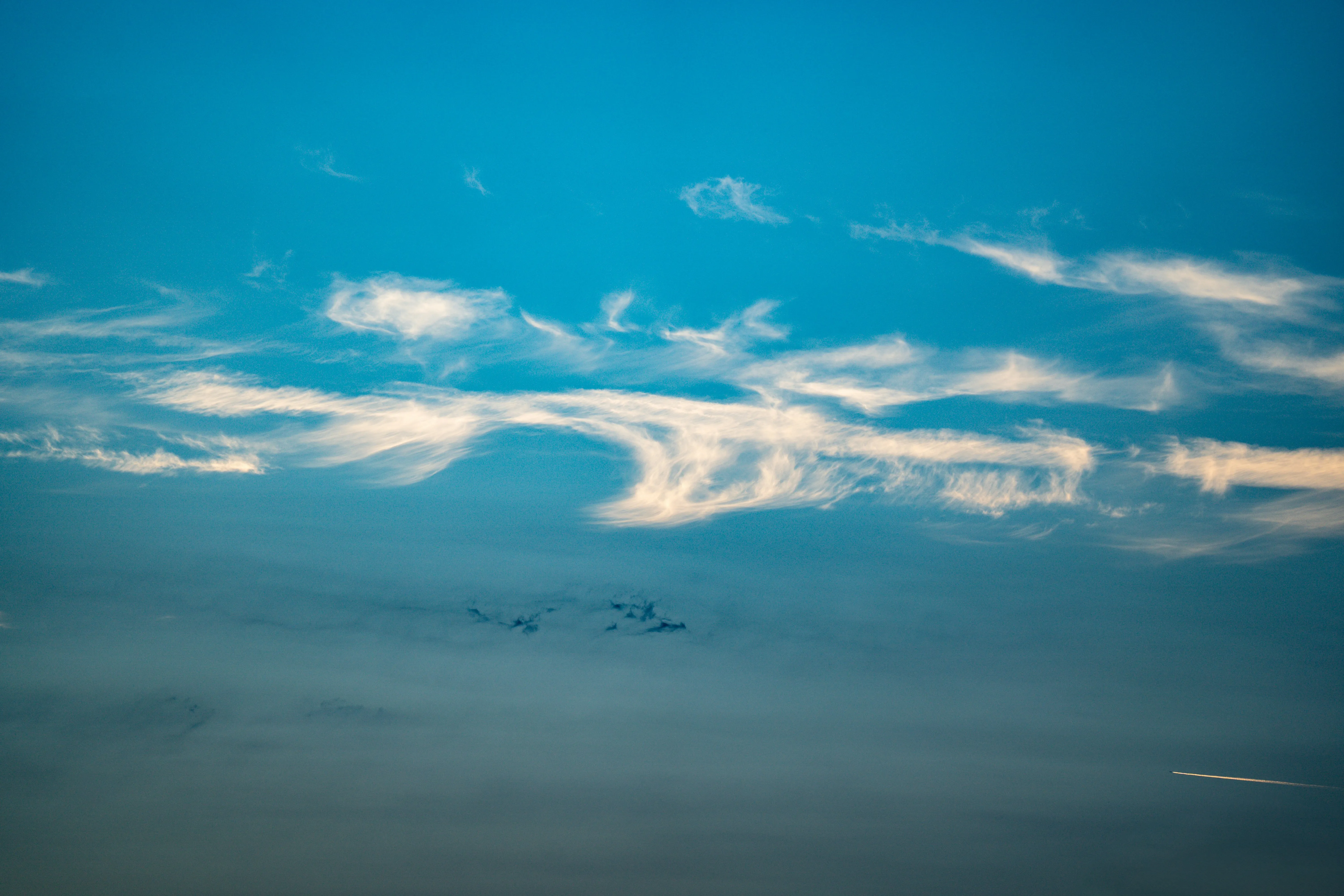 Clouds Over Sea Horizon in a Peaceful Blue Sunset Wallpaper