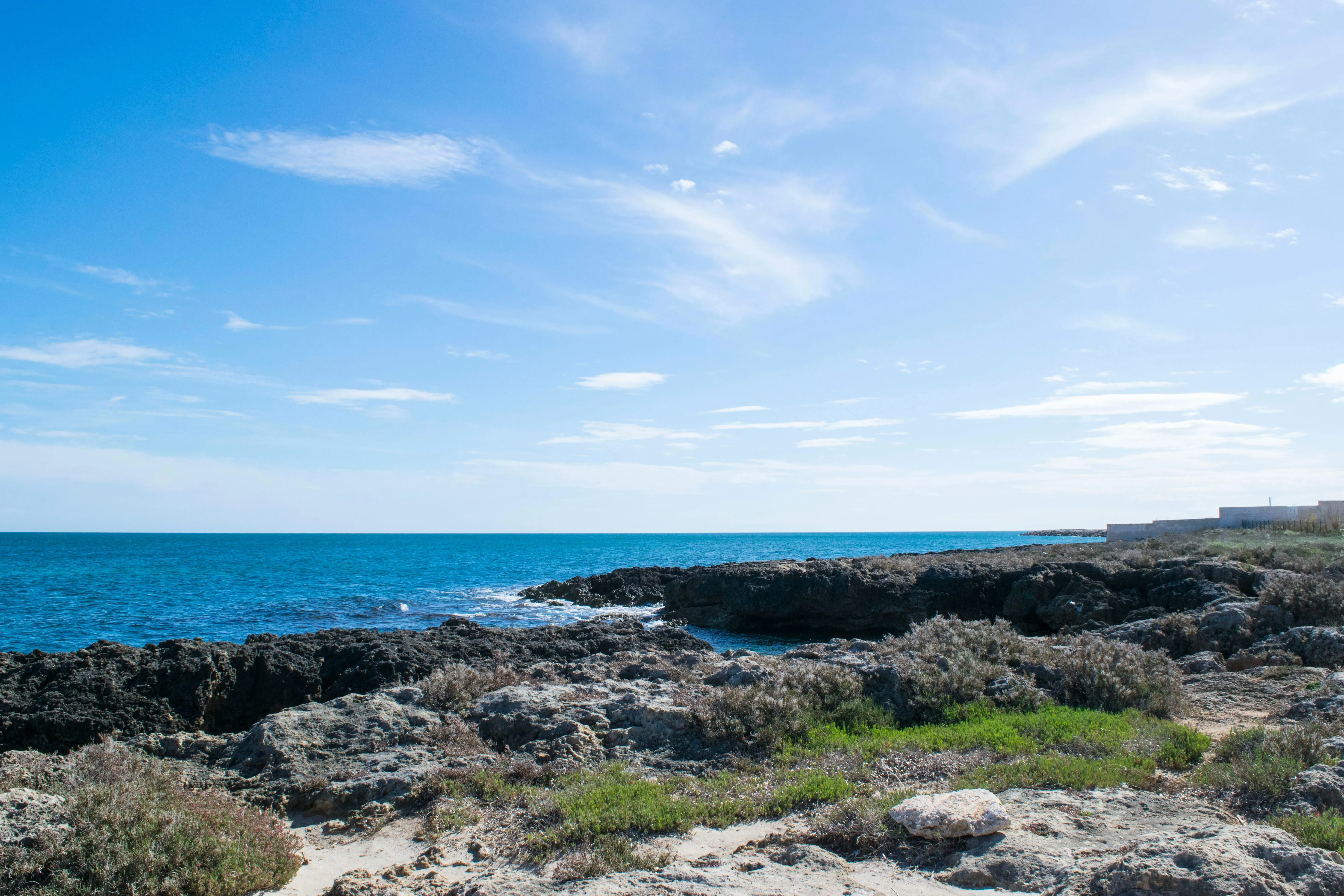 Coastal Landscape with Blue Sky and Wispy Afternoon Clouds