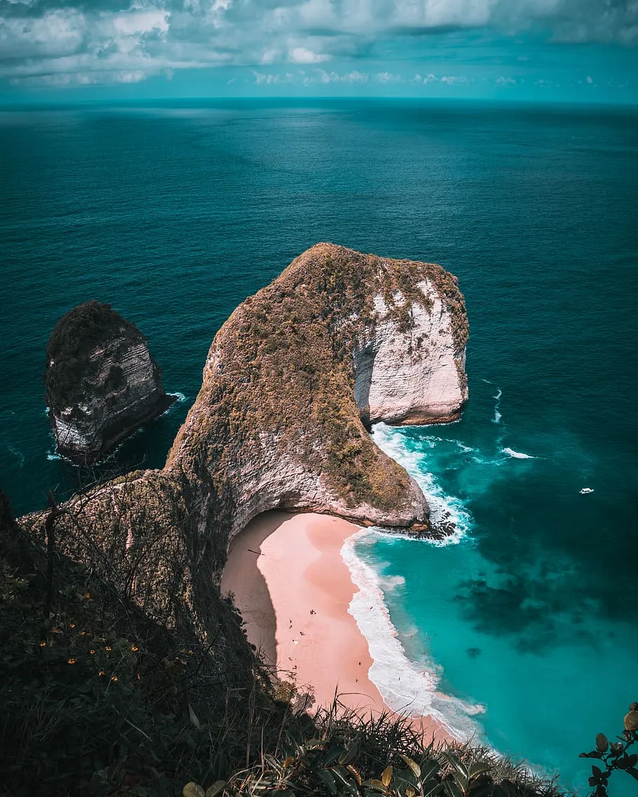 Coastal Rock Formation Surrounded By Turquoise Water