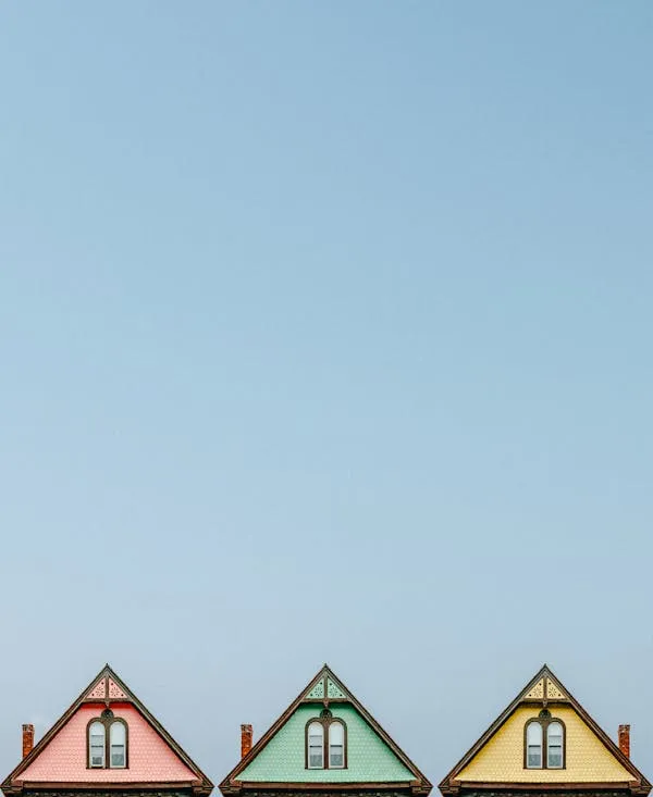 Colorful Rooftops Under a Vast and Clear Blue Background