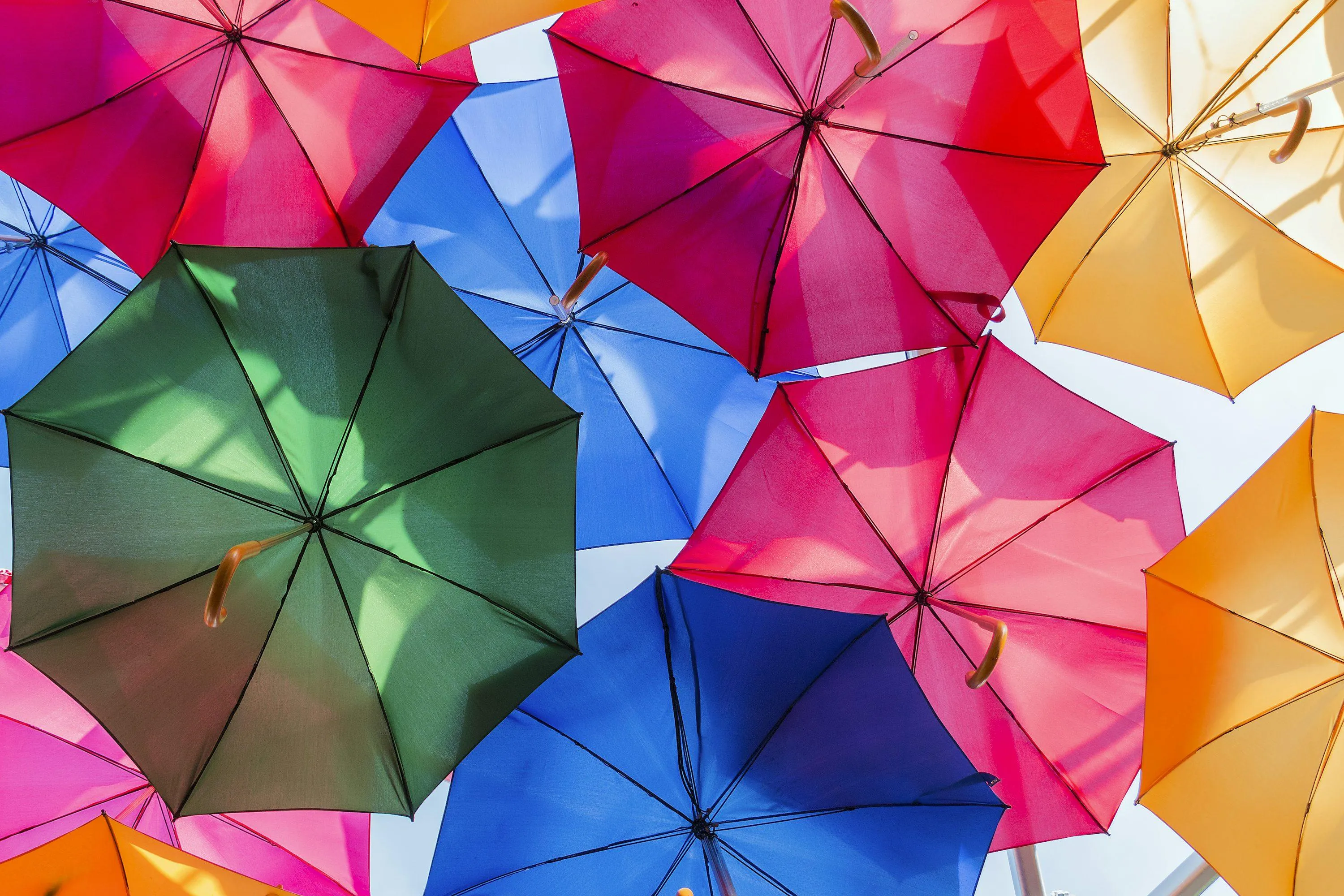 Colorful Umbrellas Overlapping in a Bright Pattern
