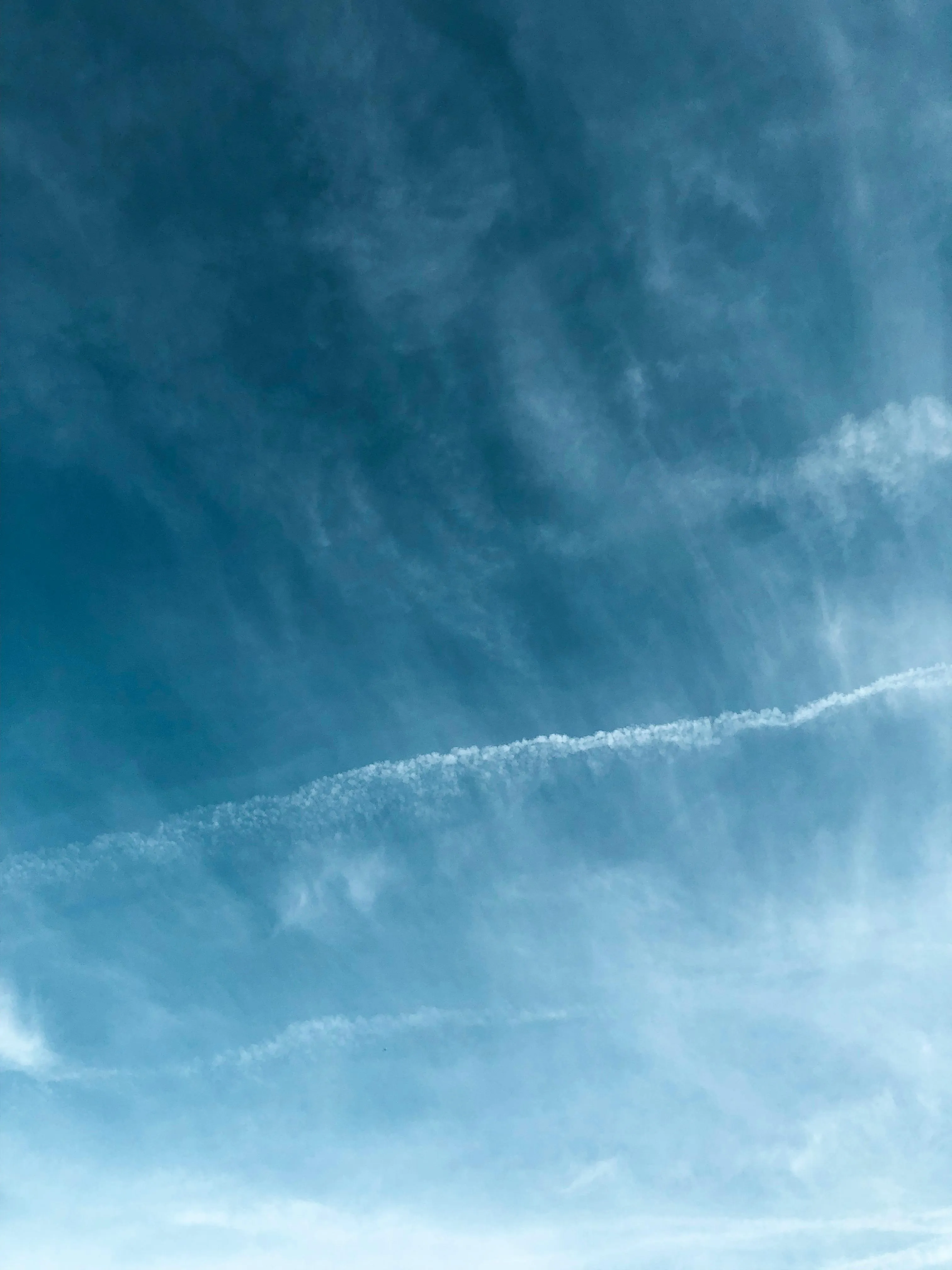 Contrail Line Cutting Across a Deep Blue Sky Wallpaper