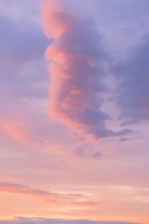 Cotton Candy Clouds Against a Colorful Sunset Horizon