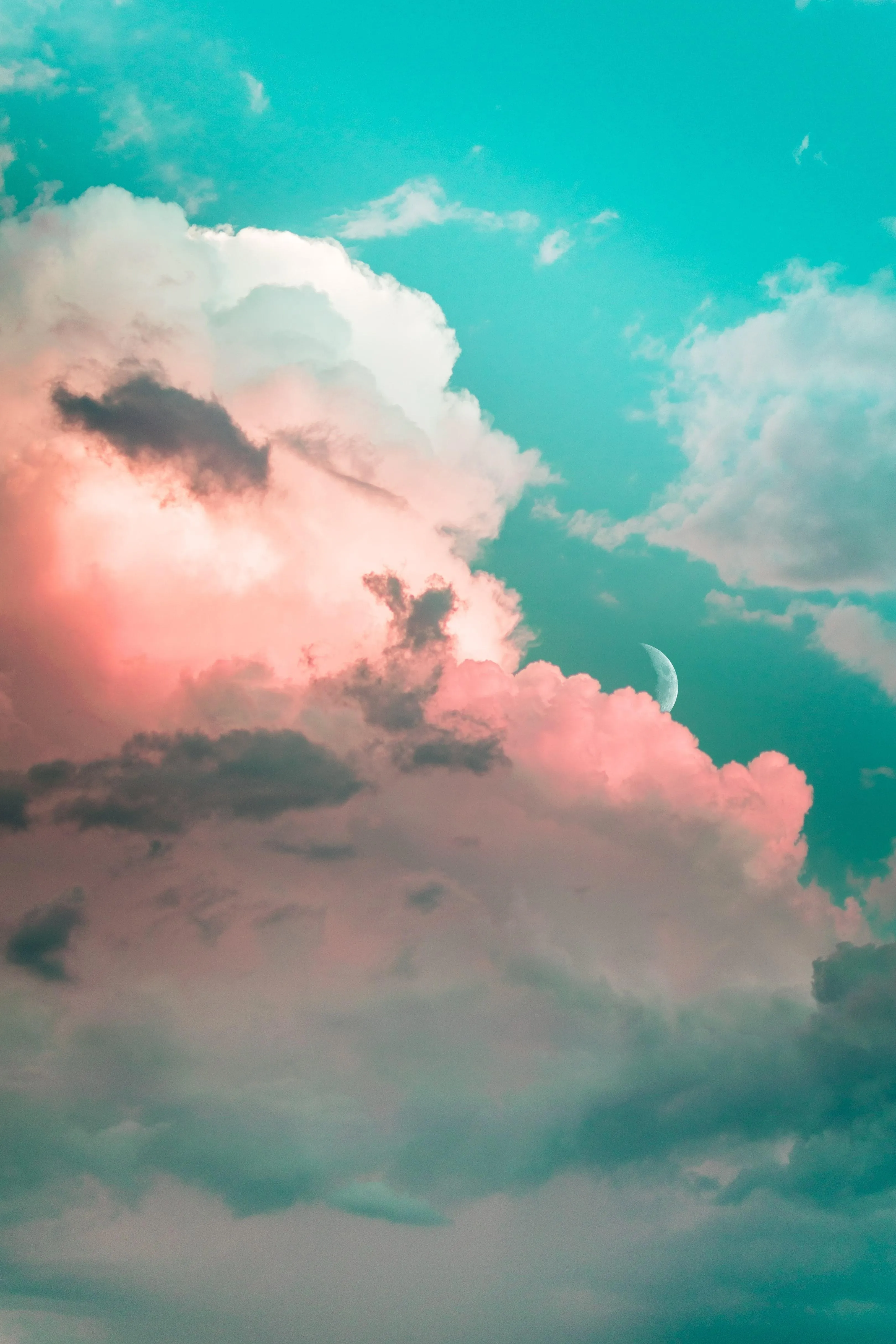 Cotton Candy Clouds Floating in Bright Turquoise Sky