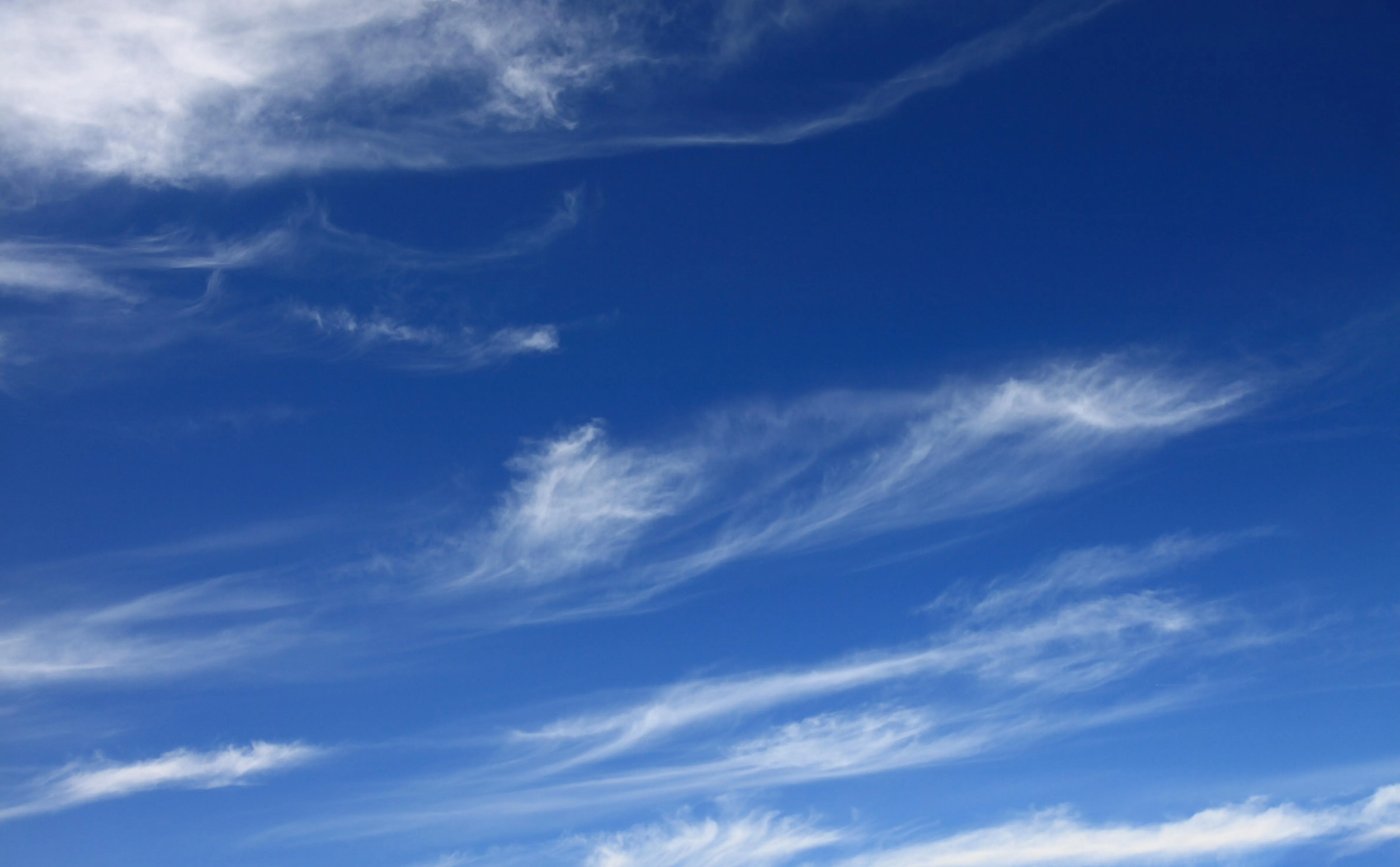 Crisp Blue Sky with Wispy White High Altitude Clouds