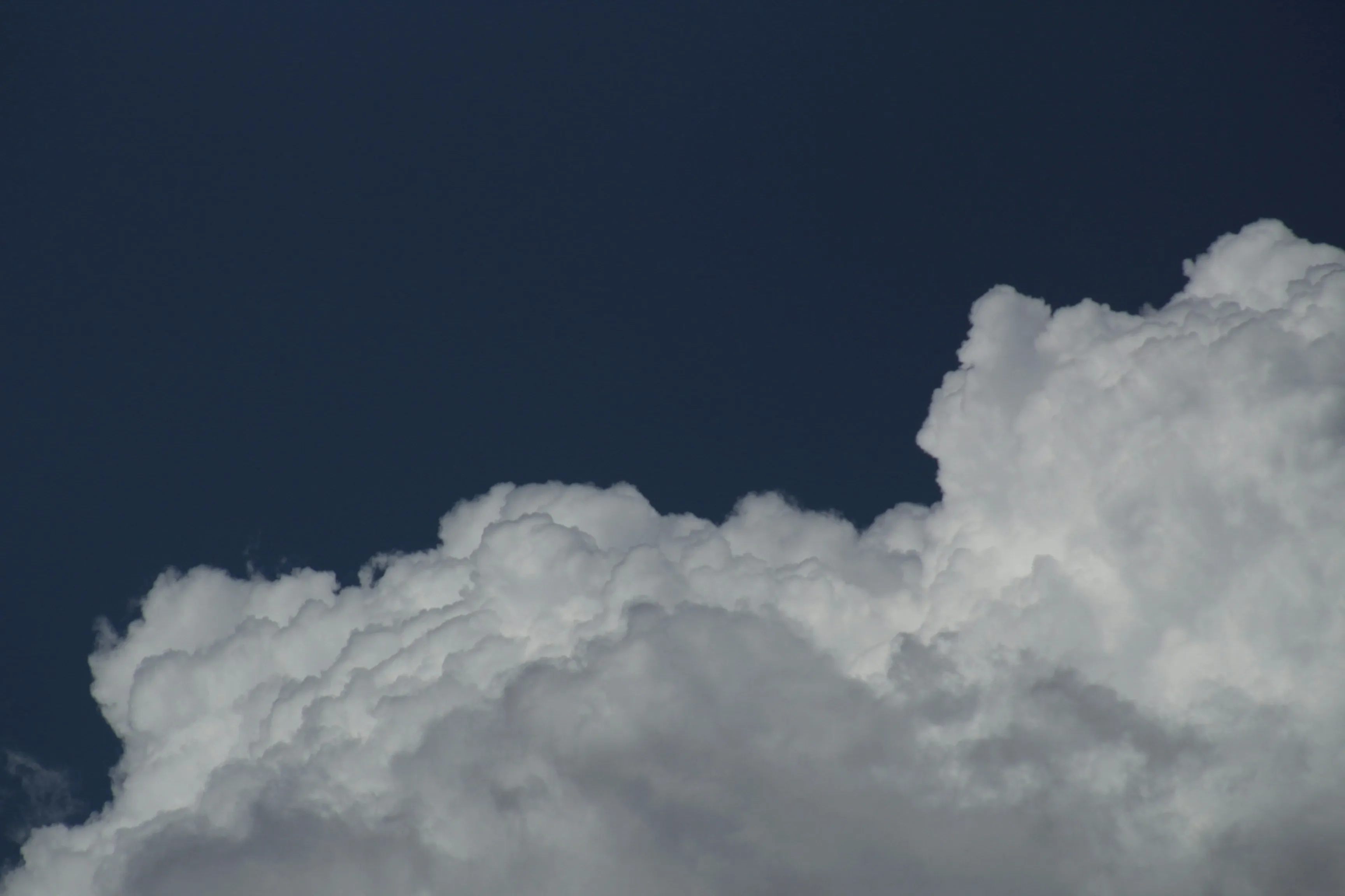 Dark Clouds Building Up Against Evening Sky Wallpaper