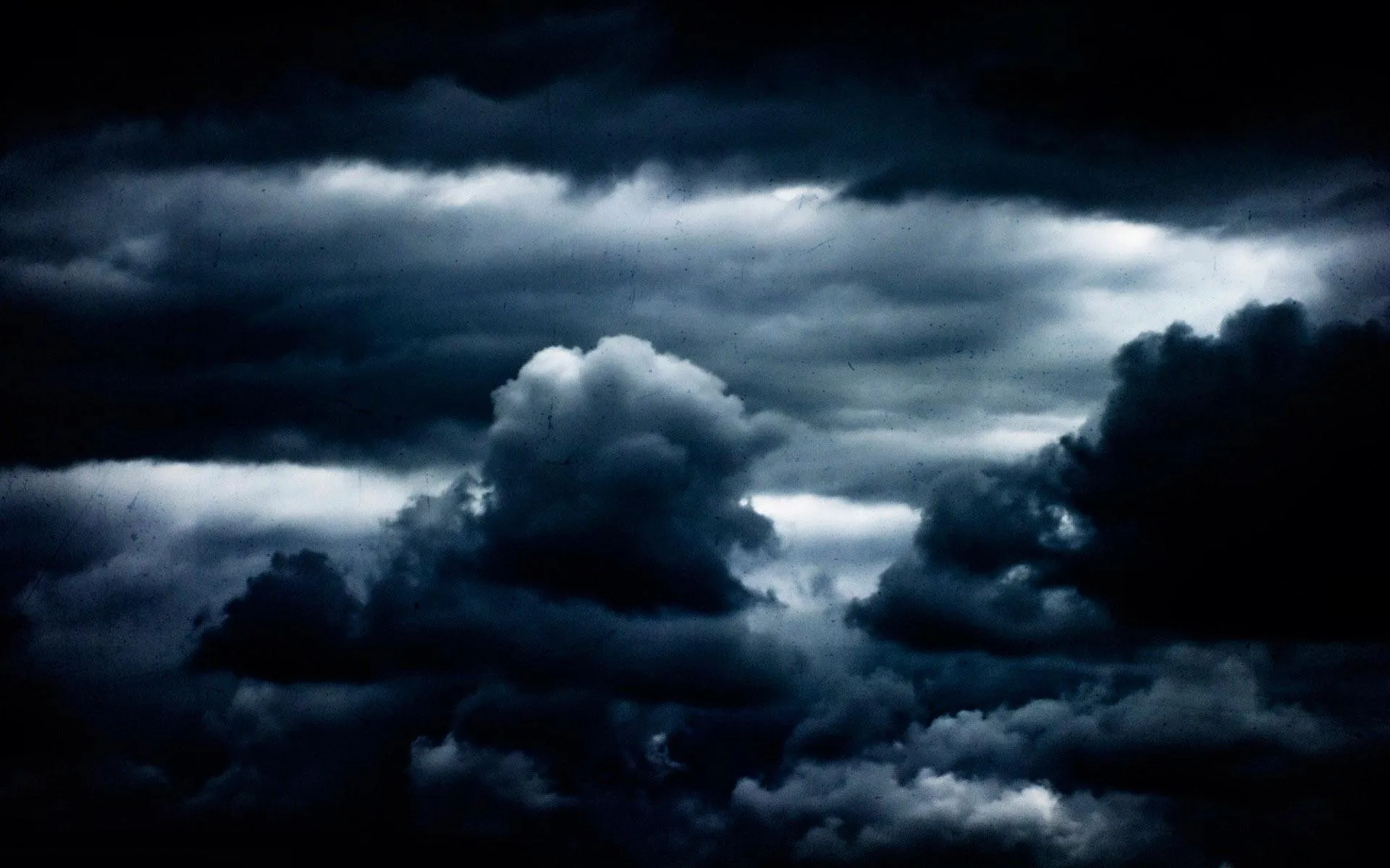 Dark Clouds Gathering in Stormy Night Sky Free 4K Wallpaper