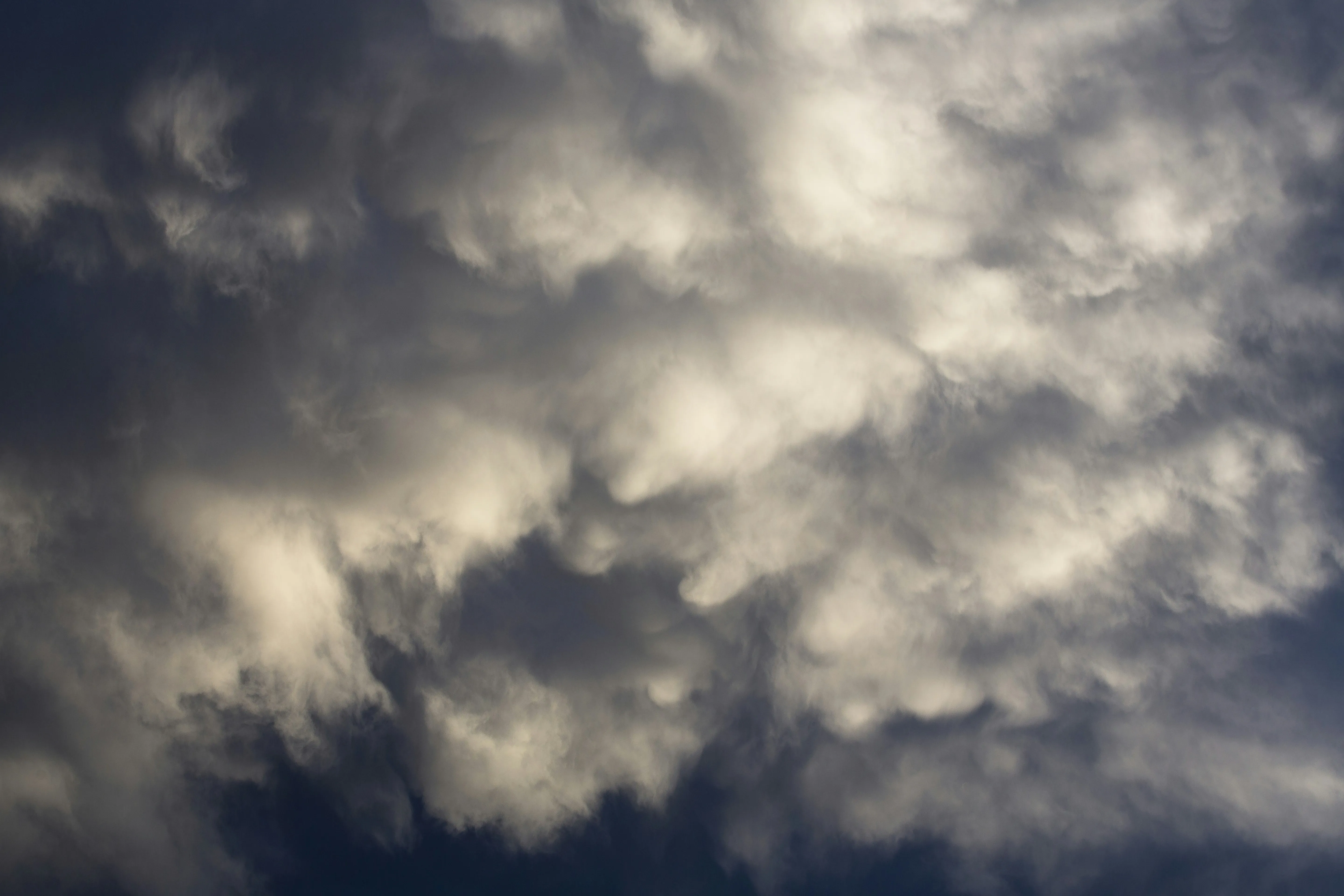 Dark Moody Clouds Gathering in Stormy Evening Sky Image