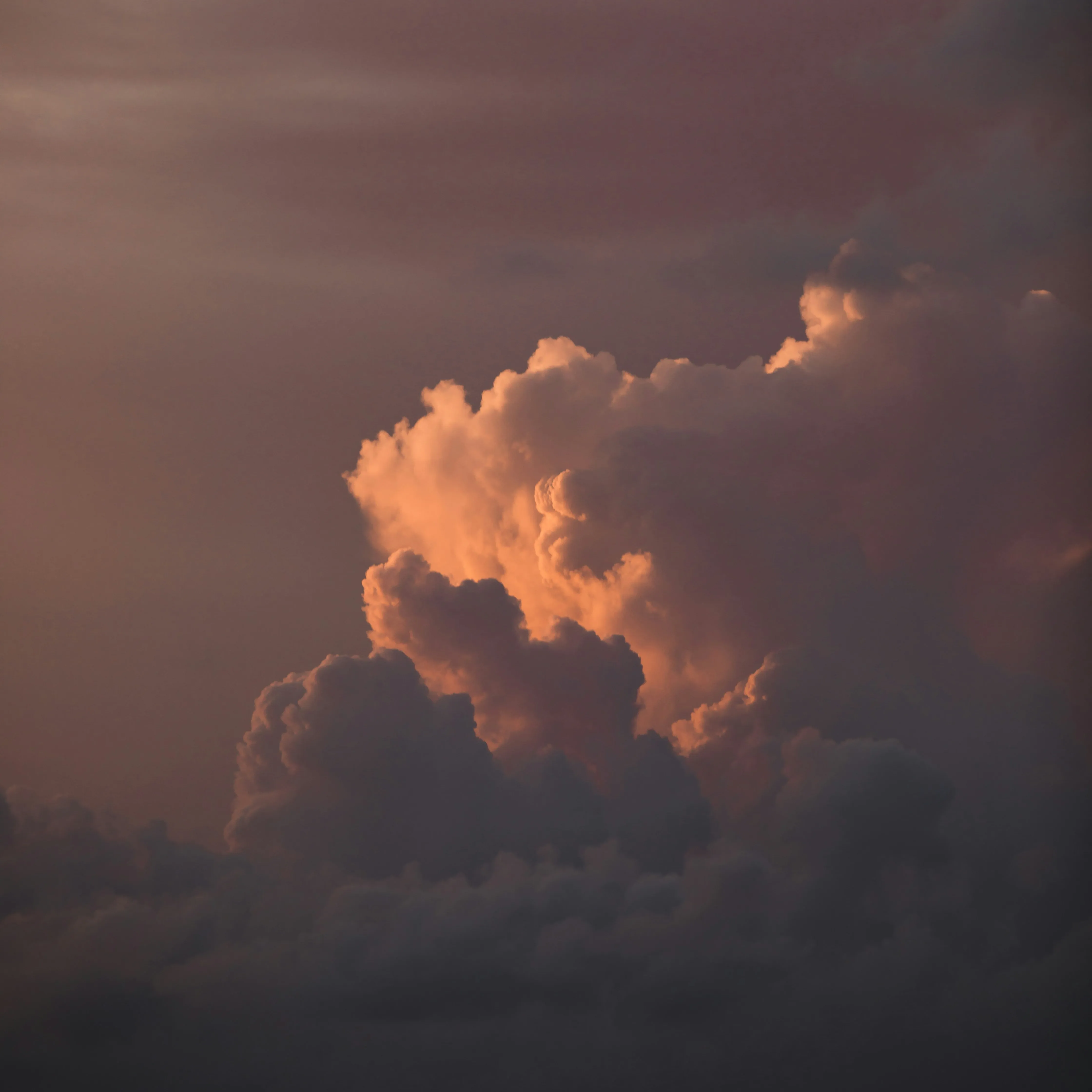 Dark Orange Clouds Lit By Sunset Against Night Sky Image